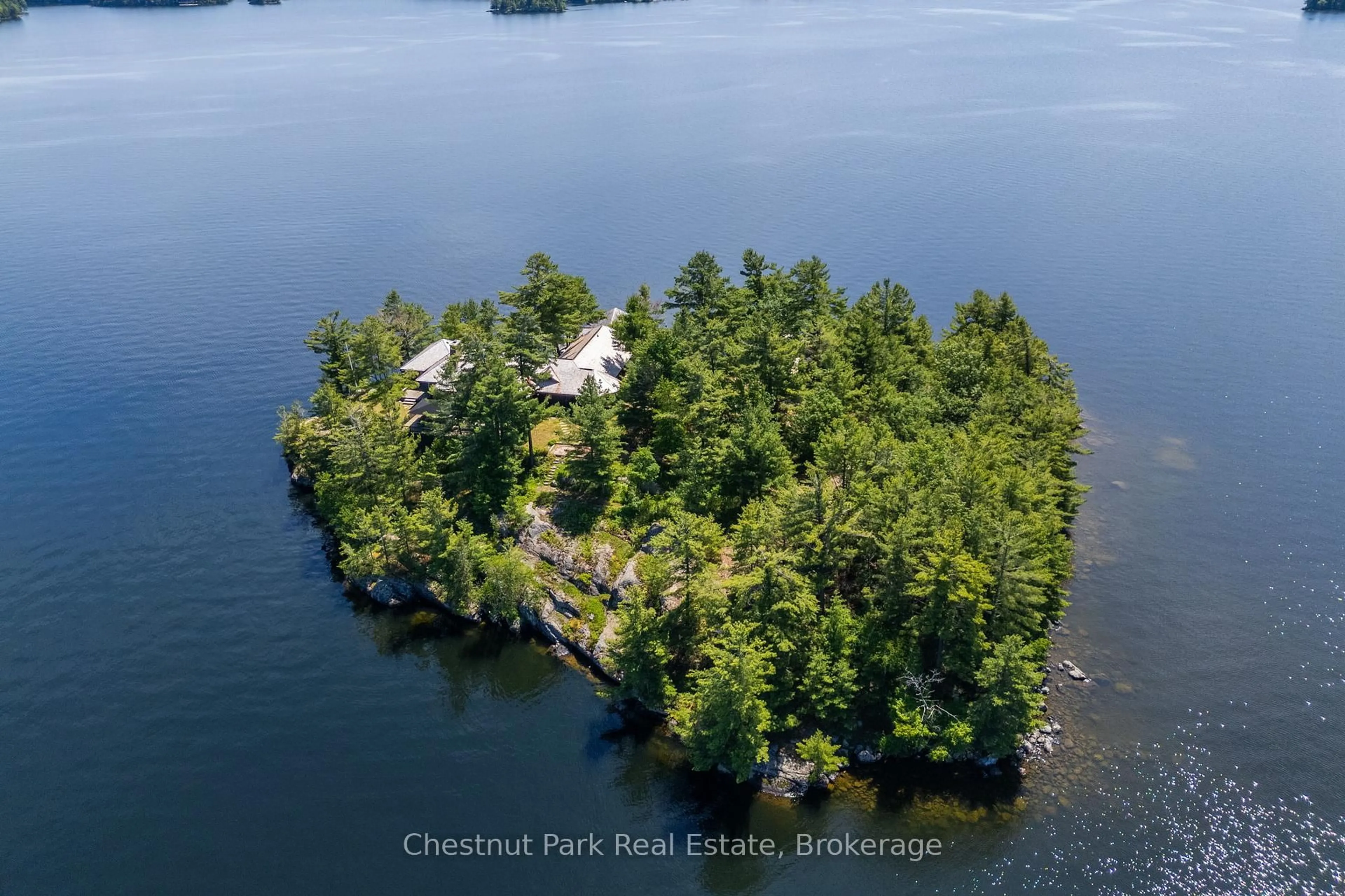 A pic from outside/outdoor area/front of a property/back of a property/a pic from drone, water/lake/river/ocean view for 1 ONAWAY ISLAND R21, Muskoka Lakes Ontario P0B 1J0