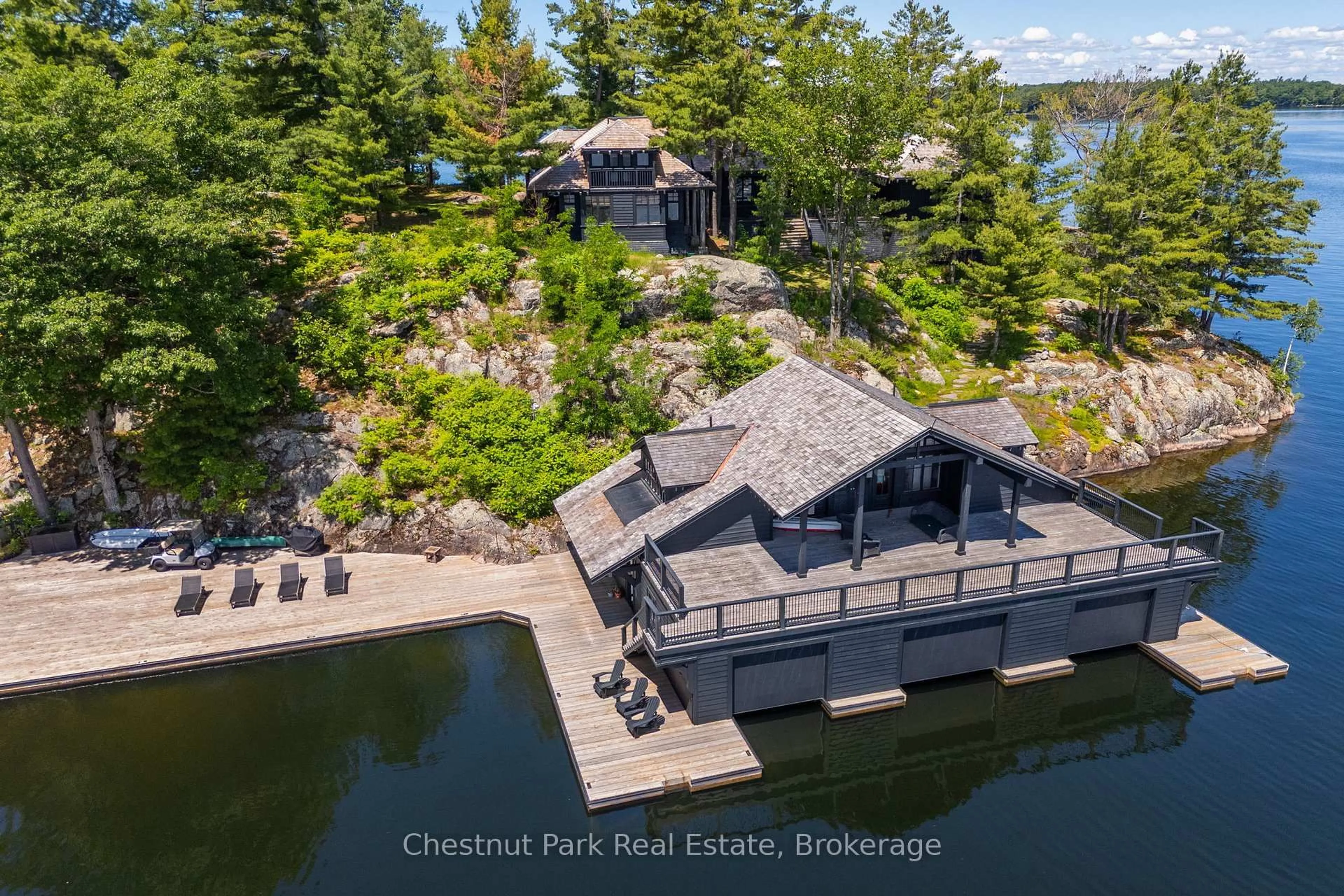 A pic from outside/outdoor area/front of a property/back of a property/a pic from drone, water/lake/river/ocean view for 1 ONAWAY ISLAND R21, Muskoka Lakes Ontario P0B 1J0