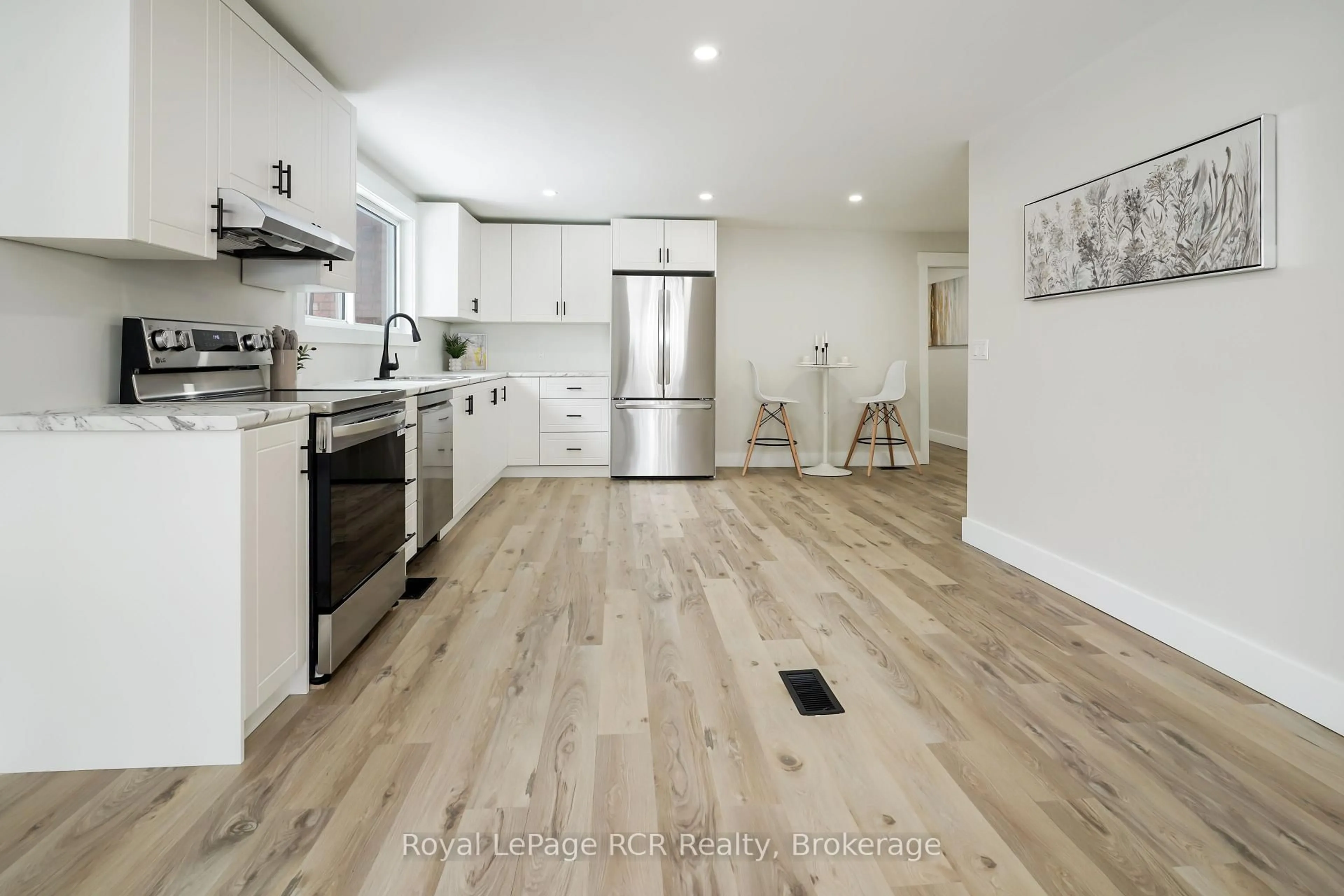 Open concept kitchen, wood/laminate floor for 221 Queen St, Chatham-Kent Ontario N0P 1T0