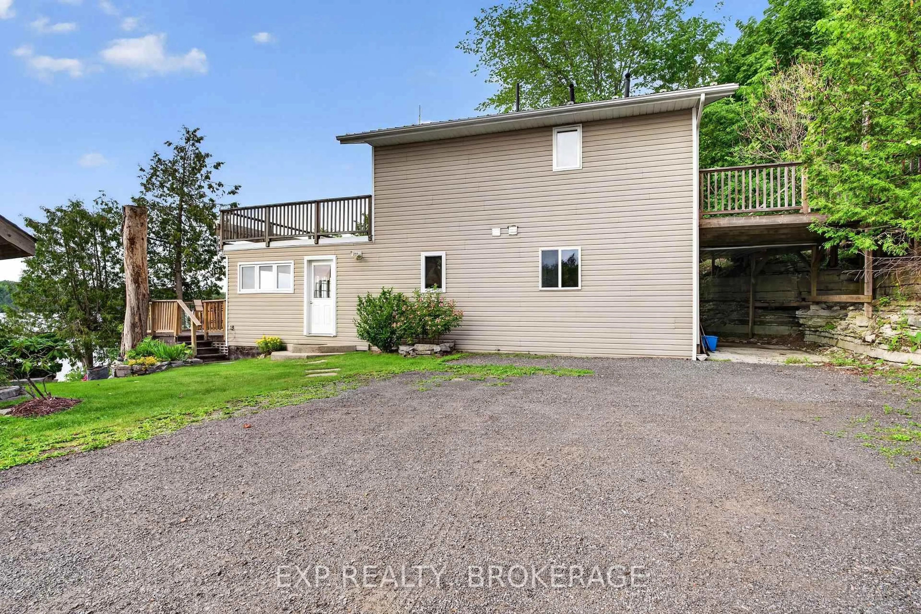 A pic from outside/outdoor area/front of a property/back of a property/a pic from drone, street for 1048 LARK Lane, Inverary Ontario K0H 1X0