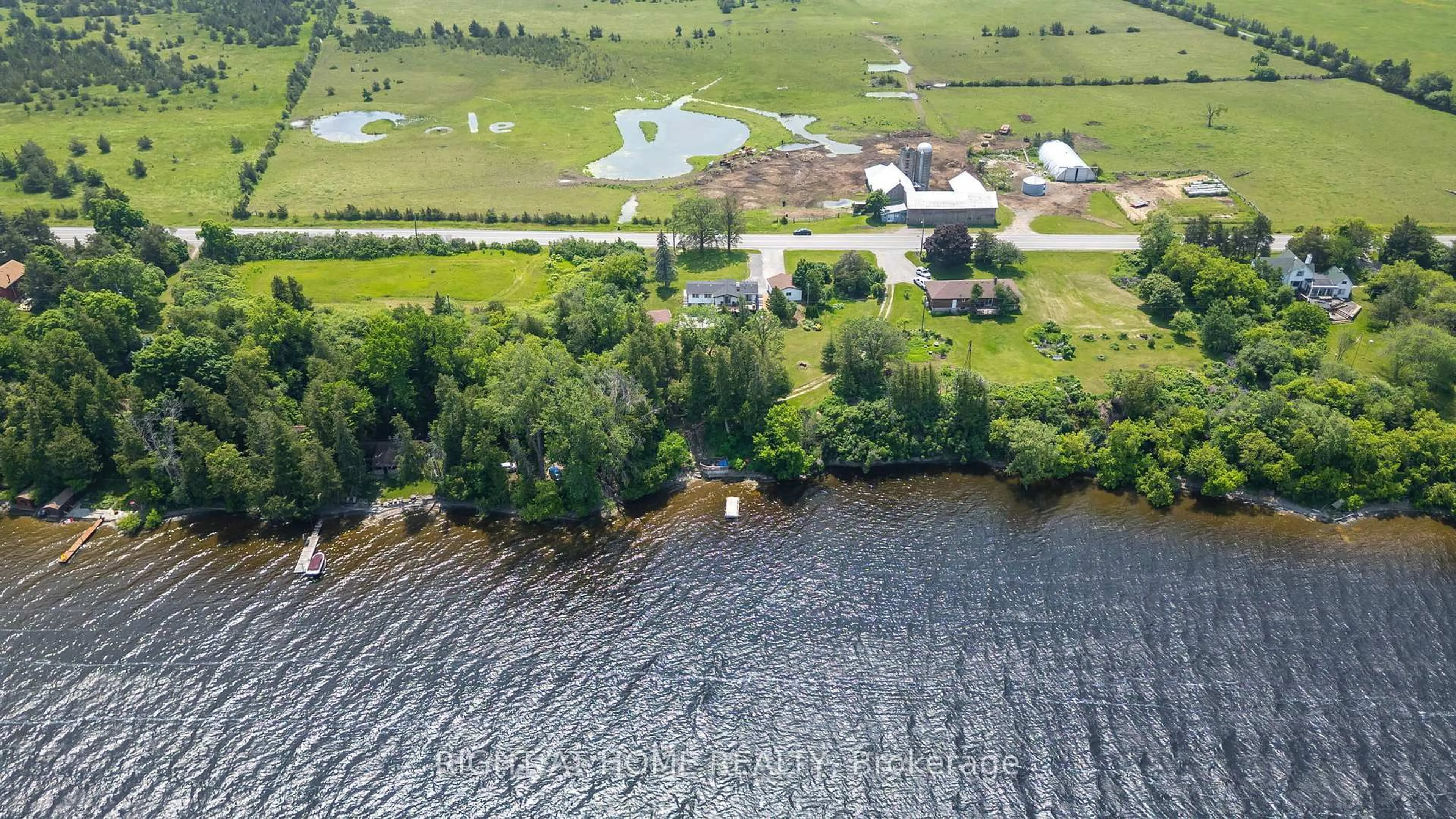 A pic from outside/outdoor area/front of a property/back of a property/a pic from drone, water/lake/river/ocean view for 4670 COUNTY ROAD 1 Rd, Prince Edward County Ontario K0K 1T0