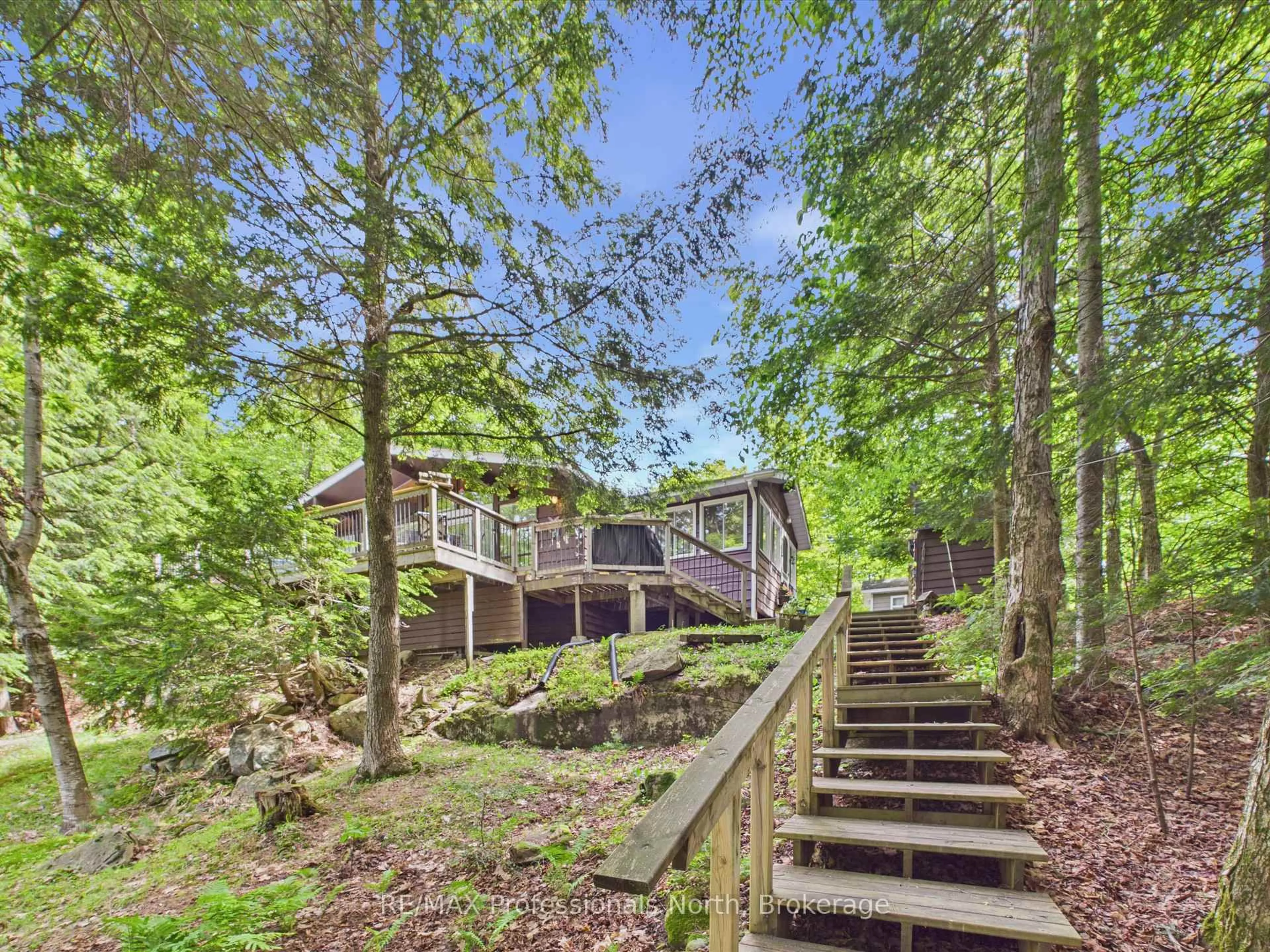 A pic from outside/outdoor area/front of a property/back of a property/a pic from drone, forest/trees view for 1007 Leech Lake Point Rd, Bracebridge Ontario P1L 1X3