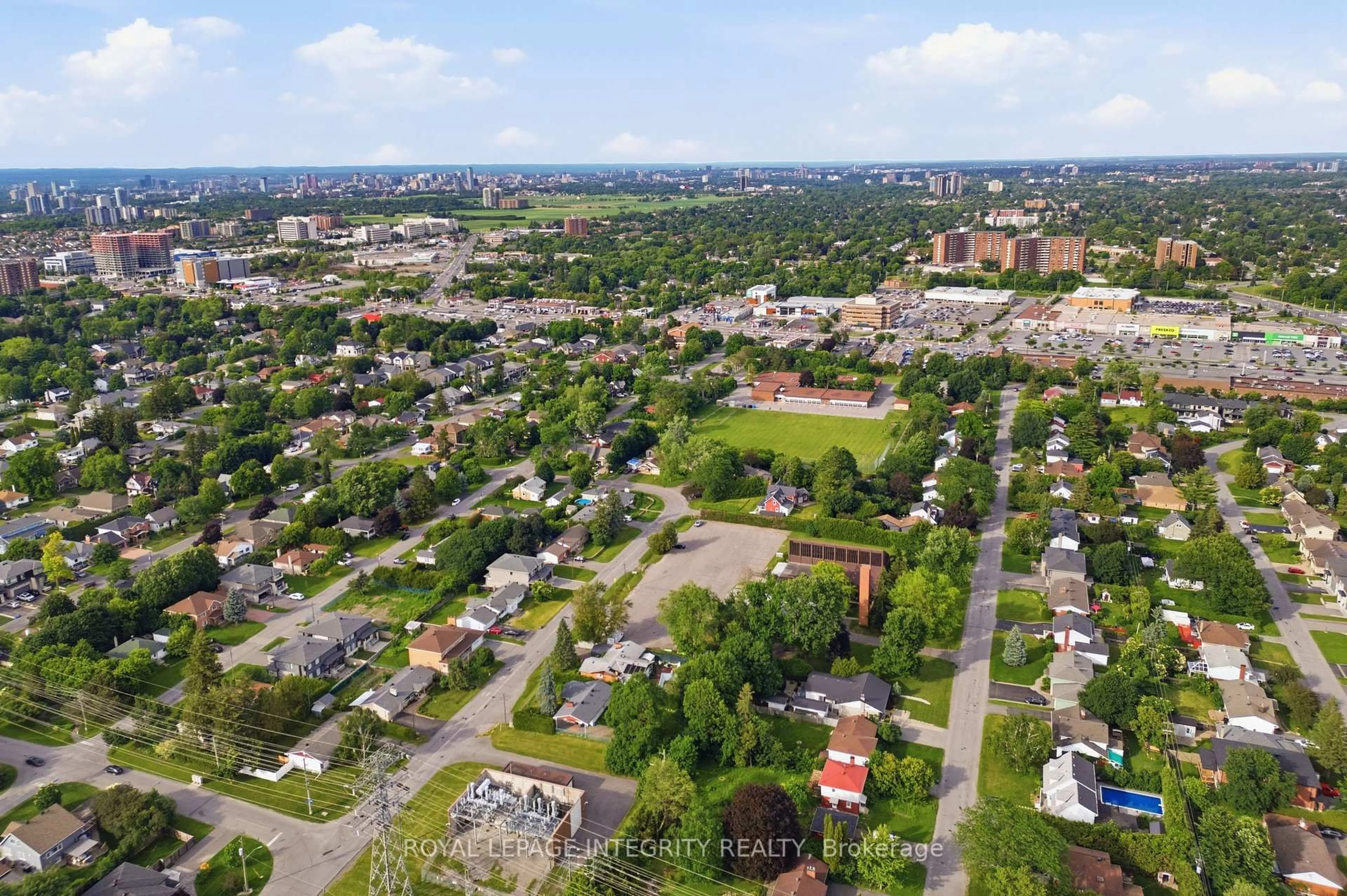 A pic from outside/outdoor area/front of a property/back of a property/a pic from drone, street for 45 Rossland Ave, Ottawa Ontario K2G 2K5