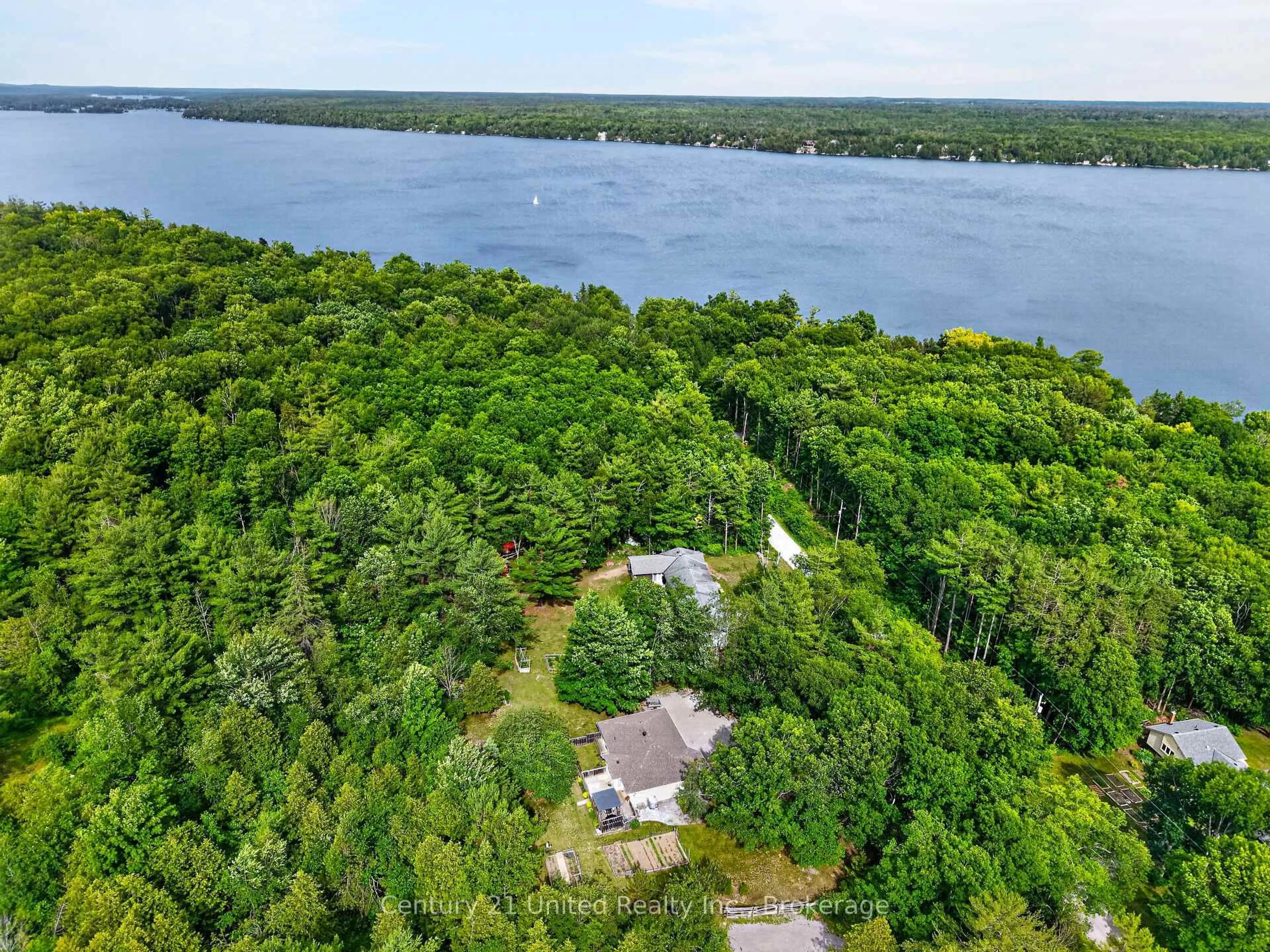 A pic from outside/outdoor area/front of a property/back of a property/a pic from drone, water/lake/river/ocean view for 3034 Clear Lake Rd, Selwyn Ontario K0L 2H0