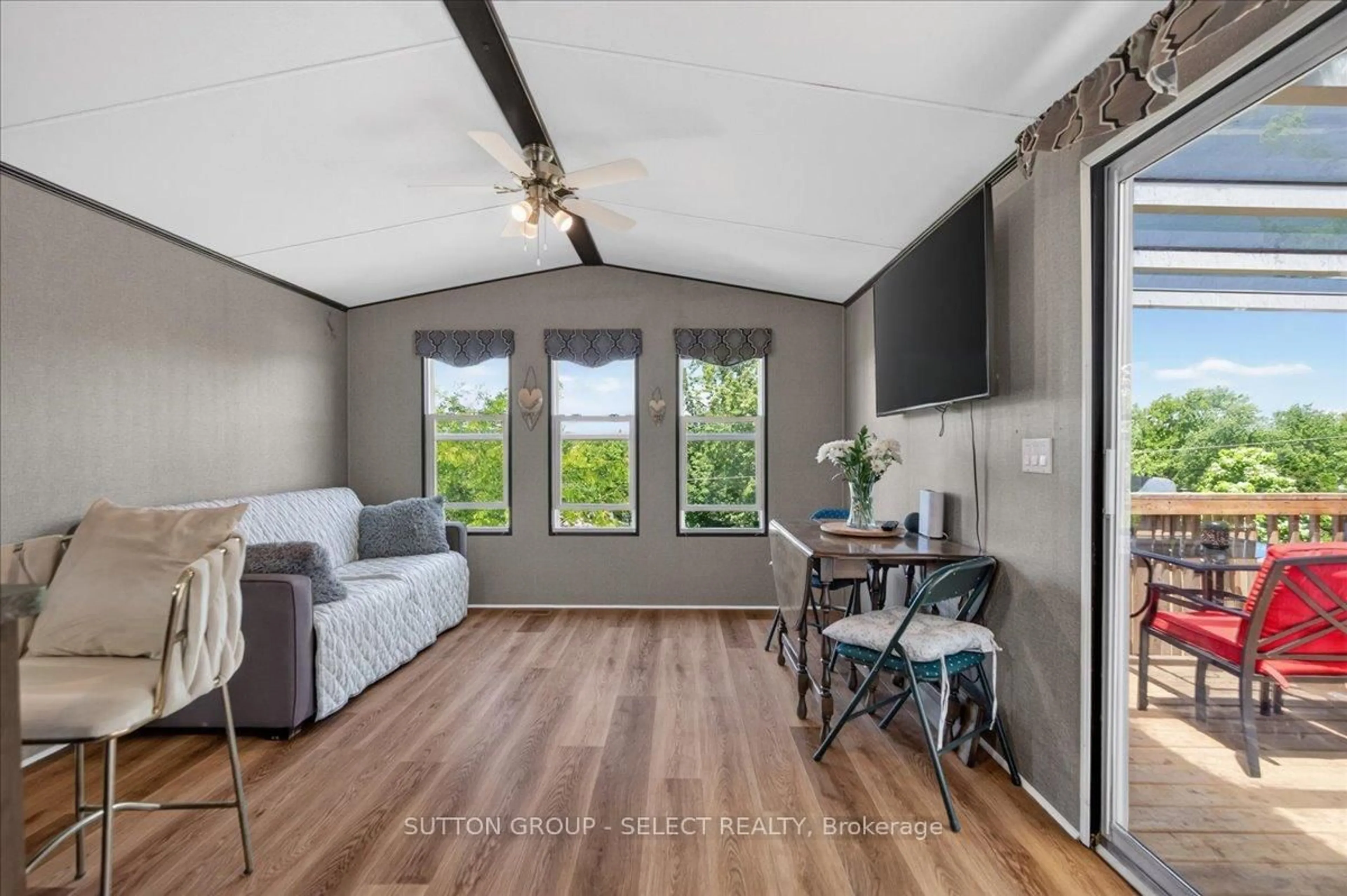 Living room with furniture, wood/laminate floor for 8685 Rock Glen Rd #403, Lambton Shores Ontario N0M 1B0