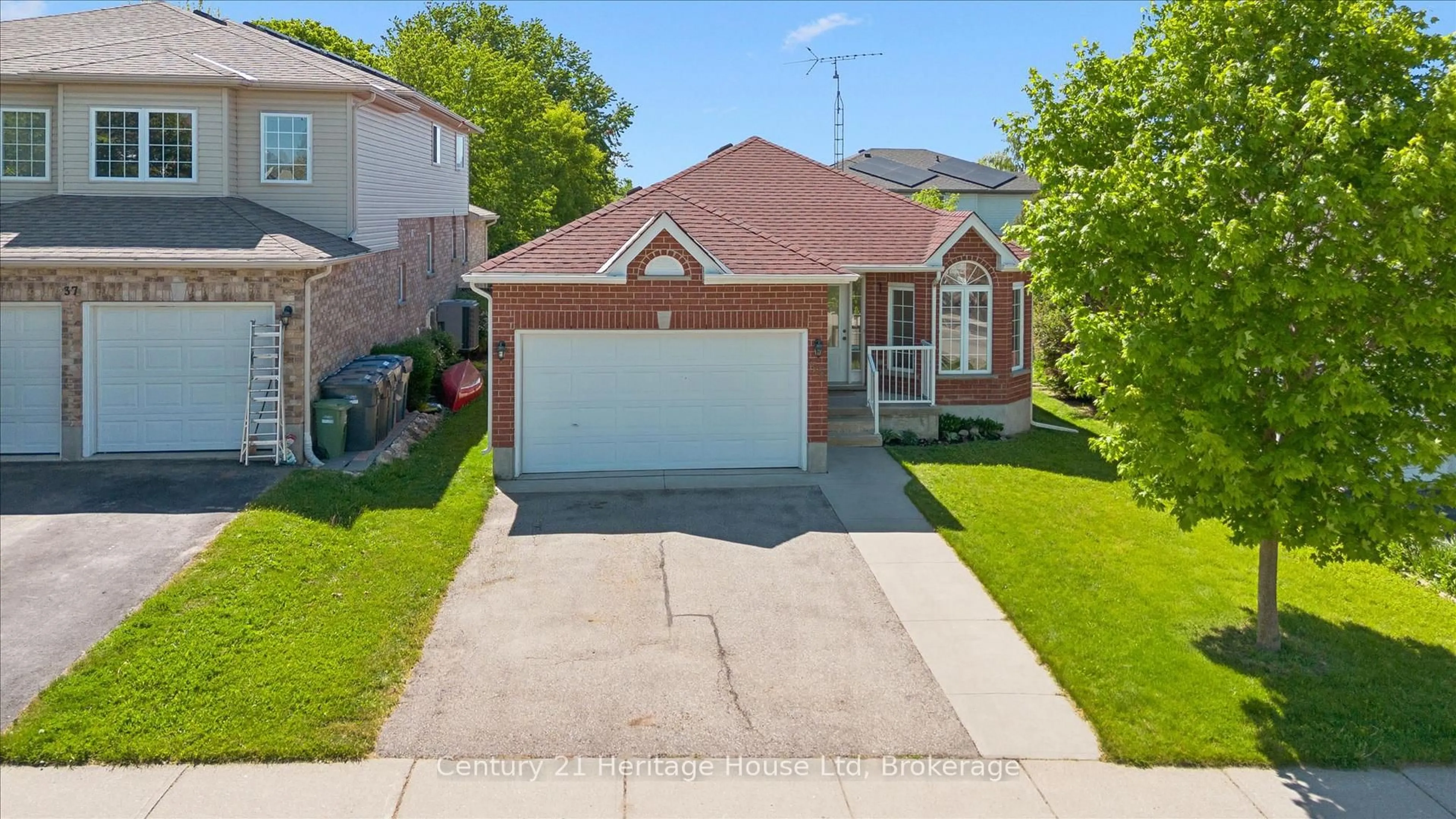 Home with brick exterior material, street for 35 Shackleton Dr, Guelph Ontario N1E 7K5