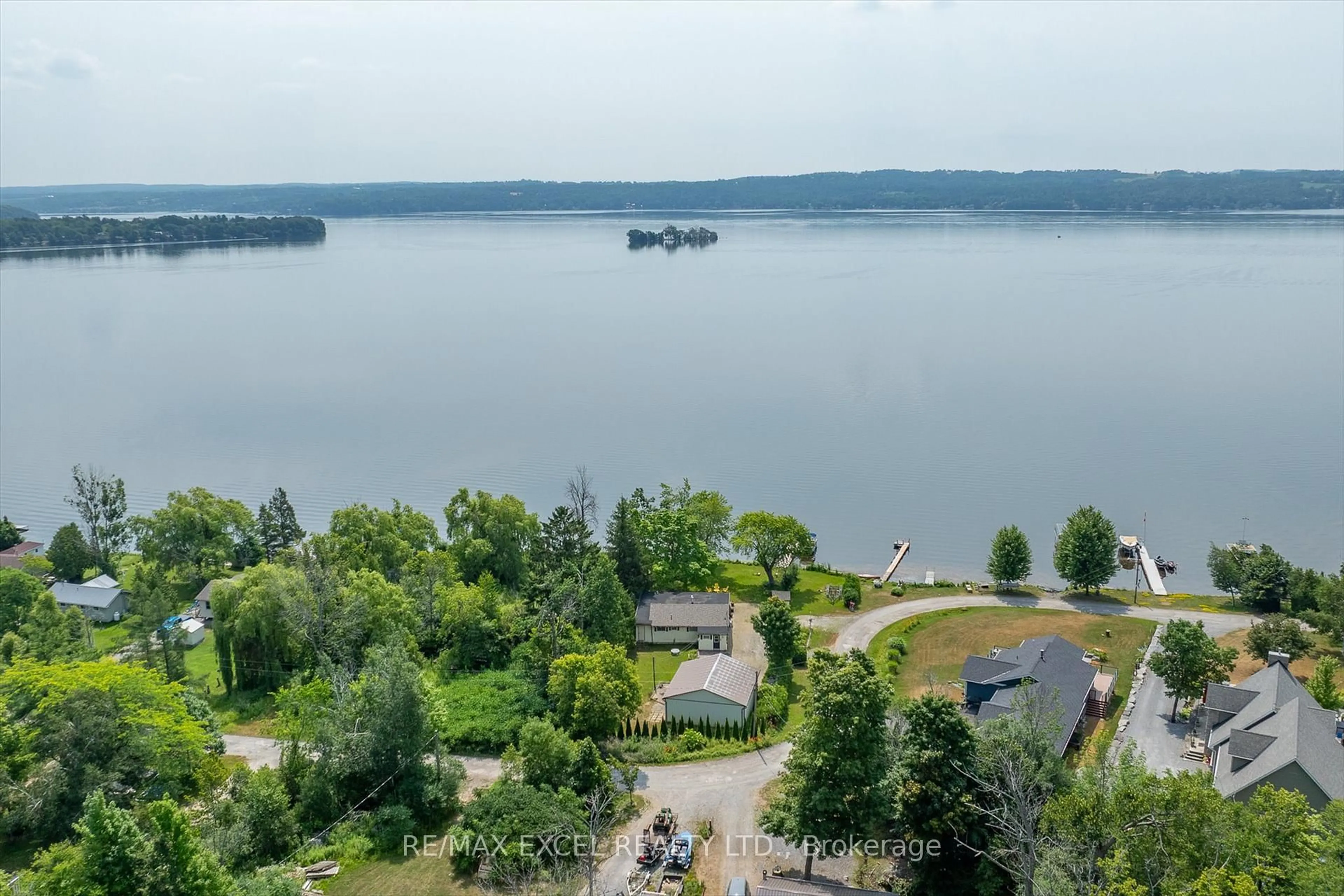 A pic from outside/outdoor area/front of a property/back of a property/a pic from drone, water/lake/river/ocean view for 665 North Shore Dr, Otonabee-South Monaghan Ontario P7B 6B3
