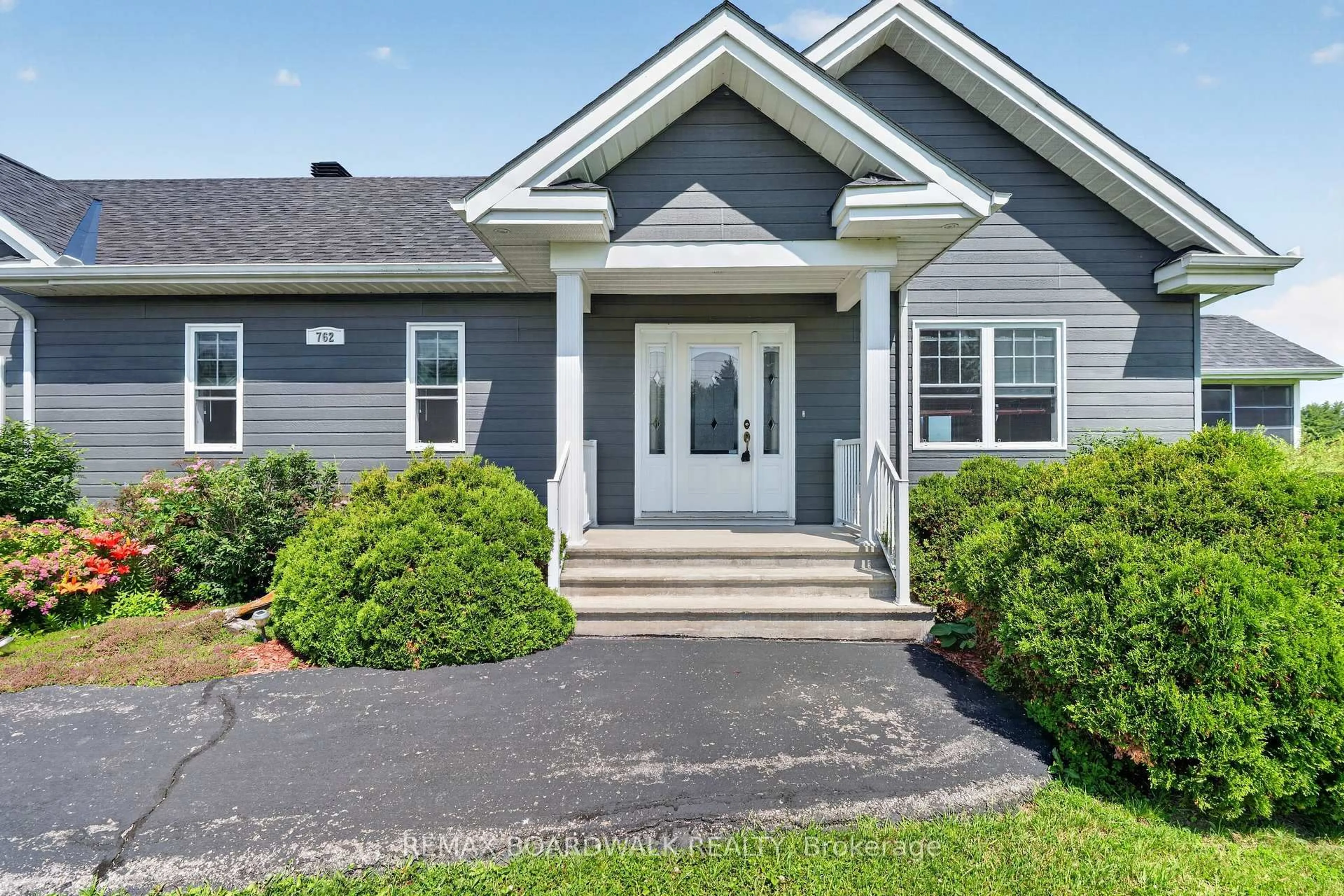 Home with vinyl exterior material, street for 762 800 Rte, The Nation Ontario K0A 3C0