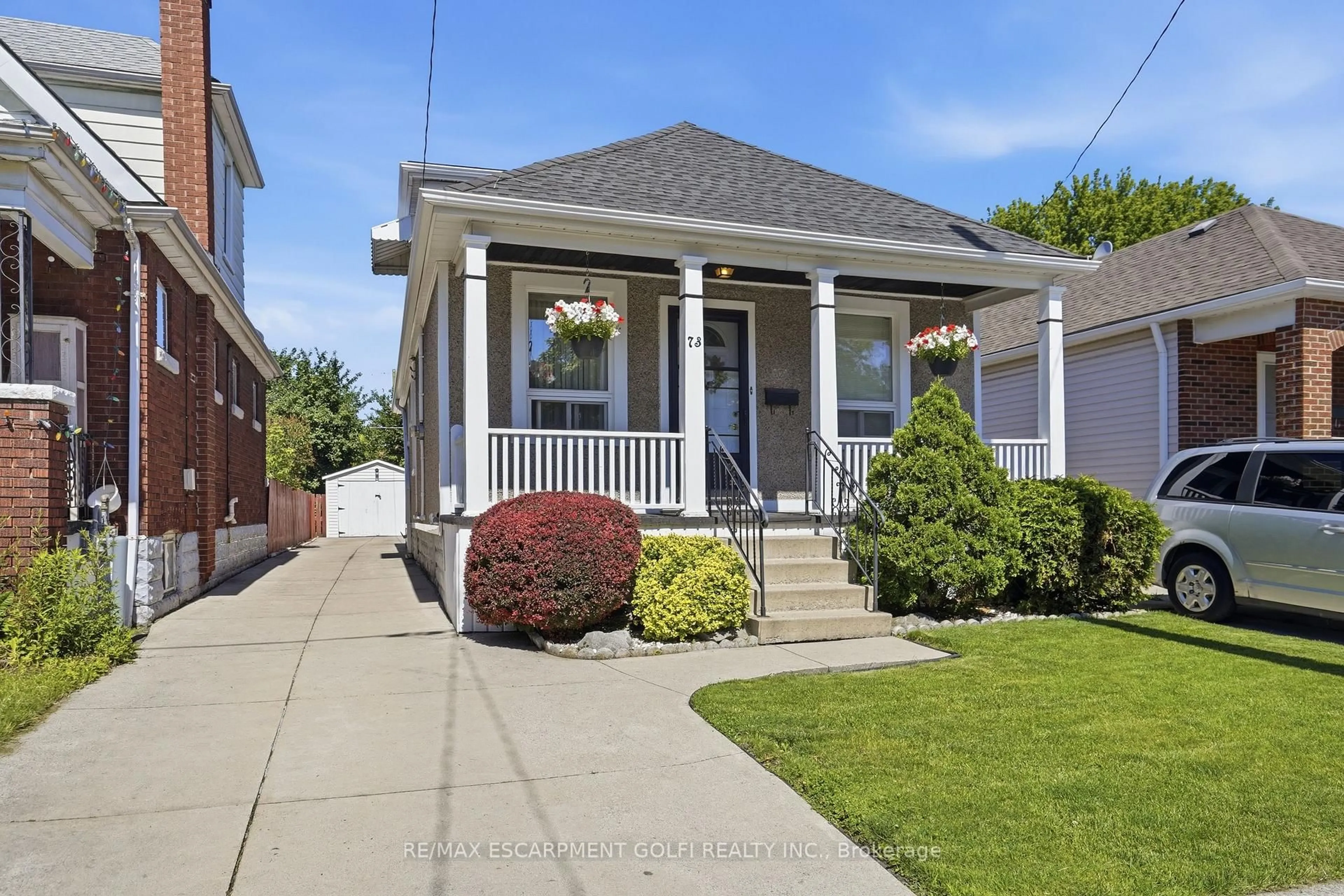 Home with vinyl exterior material, street for 73 Tuxedo Ave, Hamilton Ontario L8H 4P6
