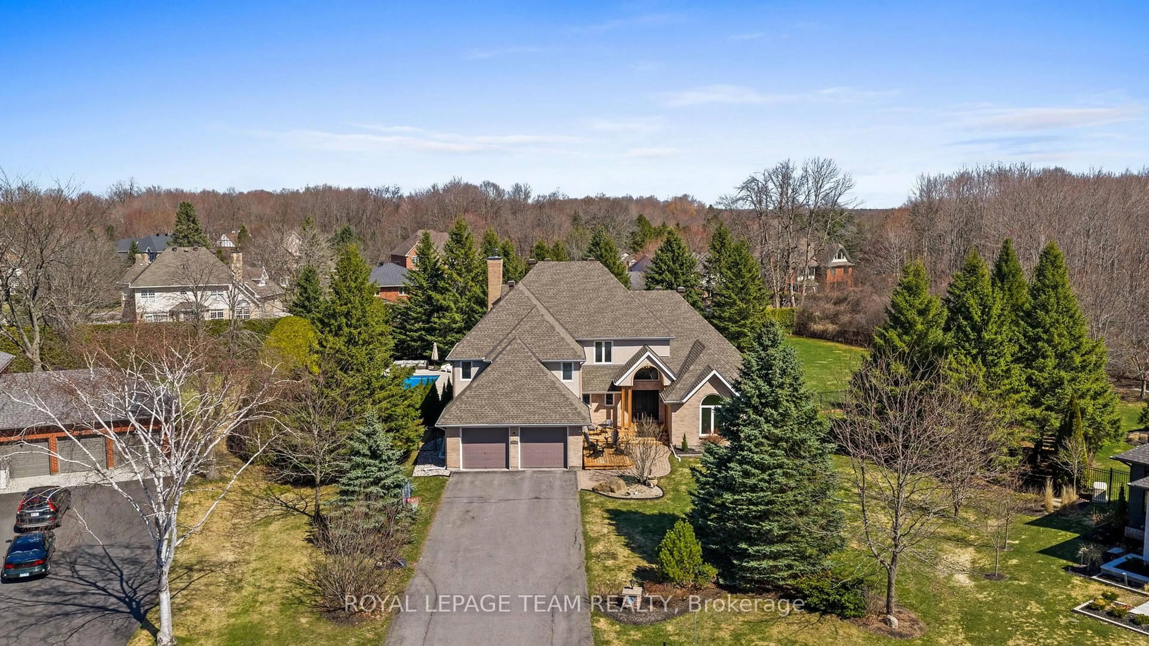 A pic from outside/outdoor area/front of a property/back of a property/a pic from drone, water/lake/river/ocean view for 1342 Revell Dr, Manotick Ontario K4M 1K8