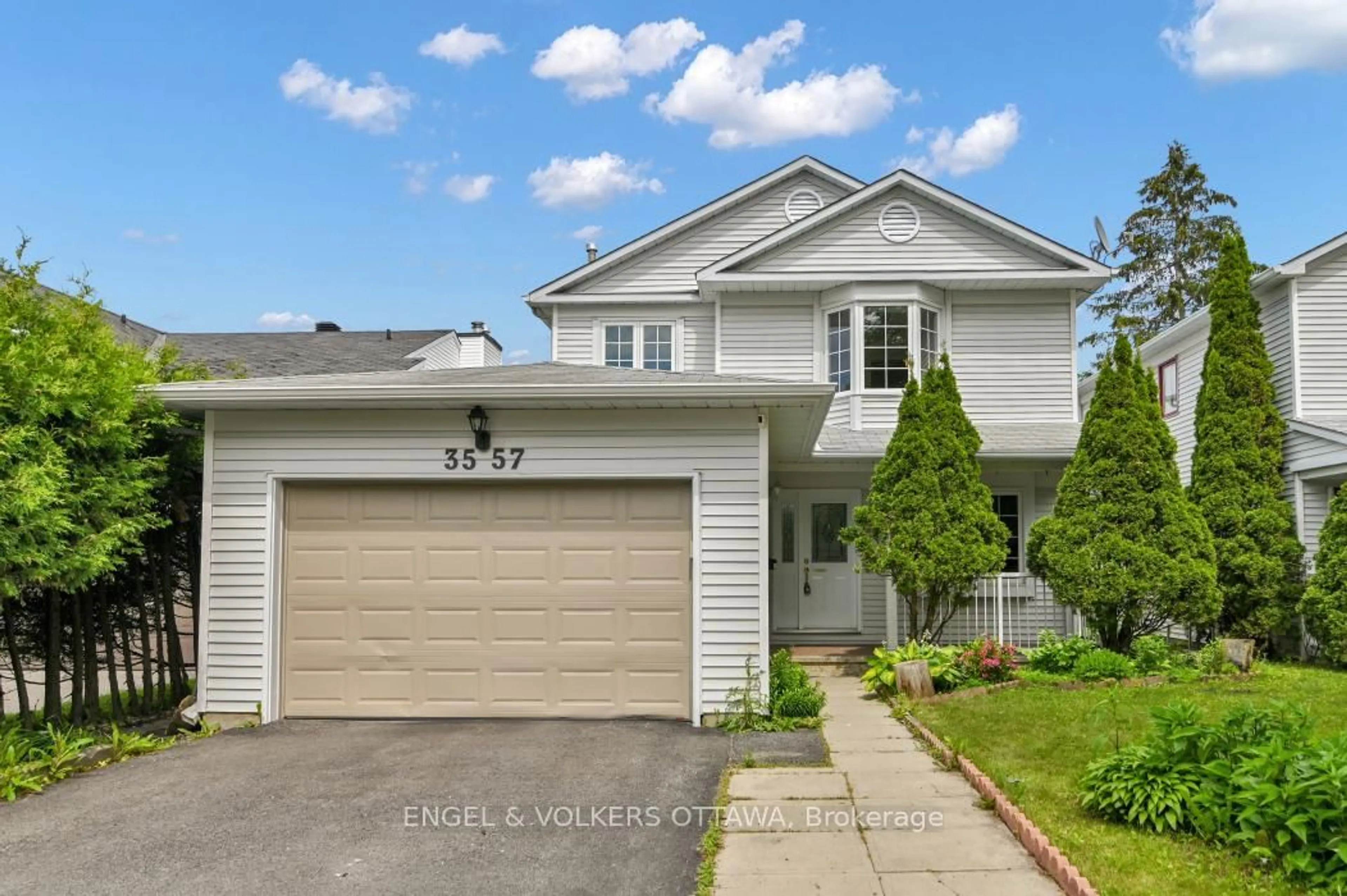 Home with vinyl exterior material, street for 3557 Trappers Rd, Ottawa Ontario K1T 2R1