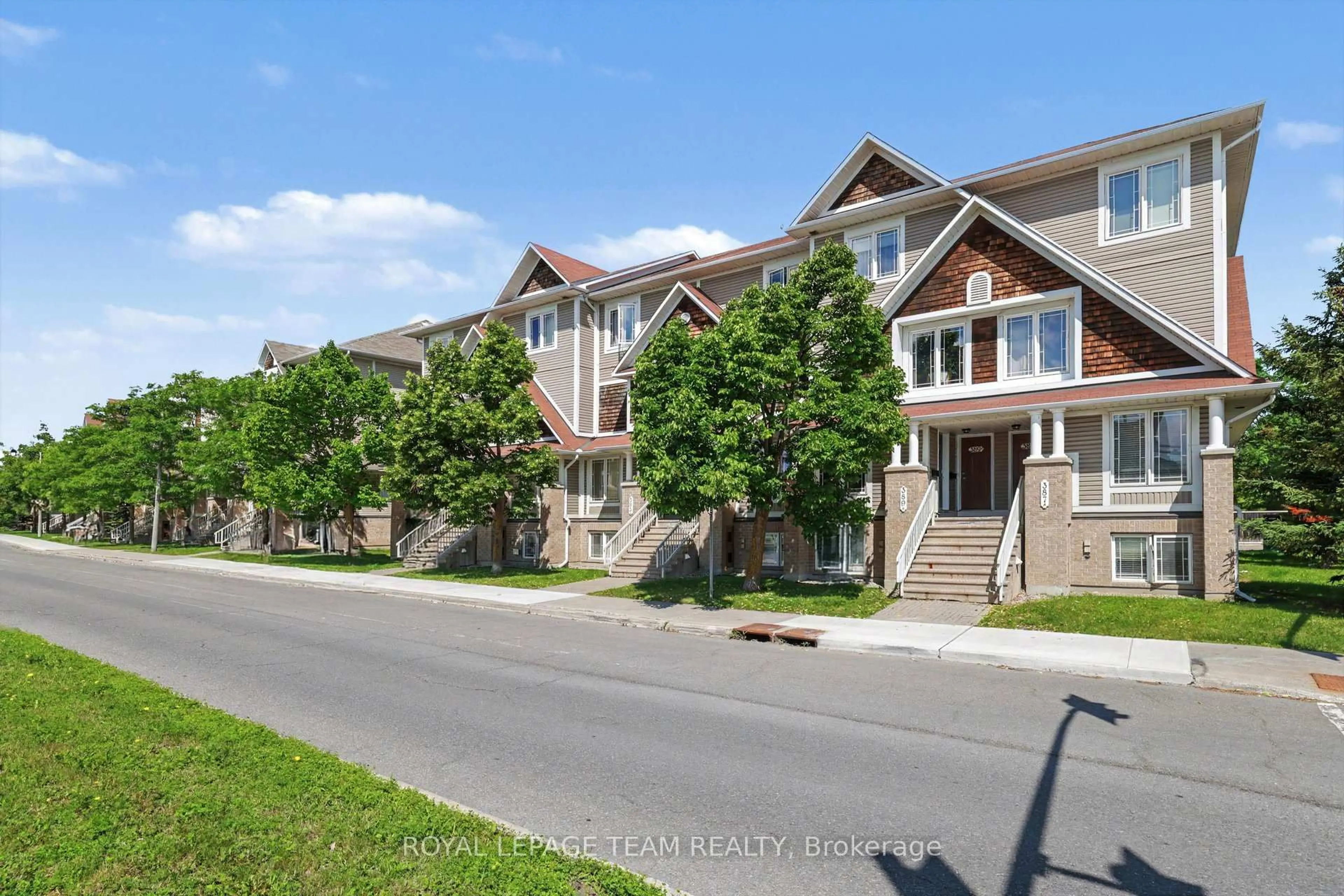 A pic from outside/outdoor area/front of a property/back of a property/a pic from drone, street for 391 Chapman Mills Dr #A, Ottawa Ontario K2J 0M7