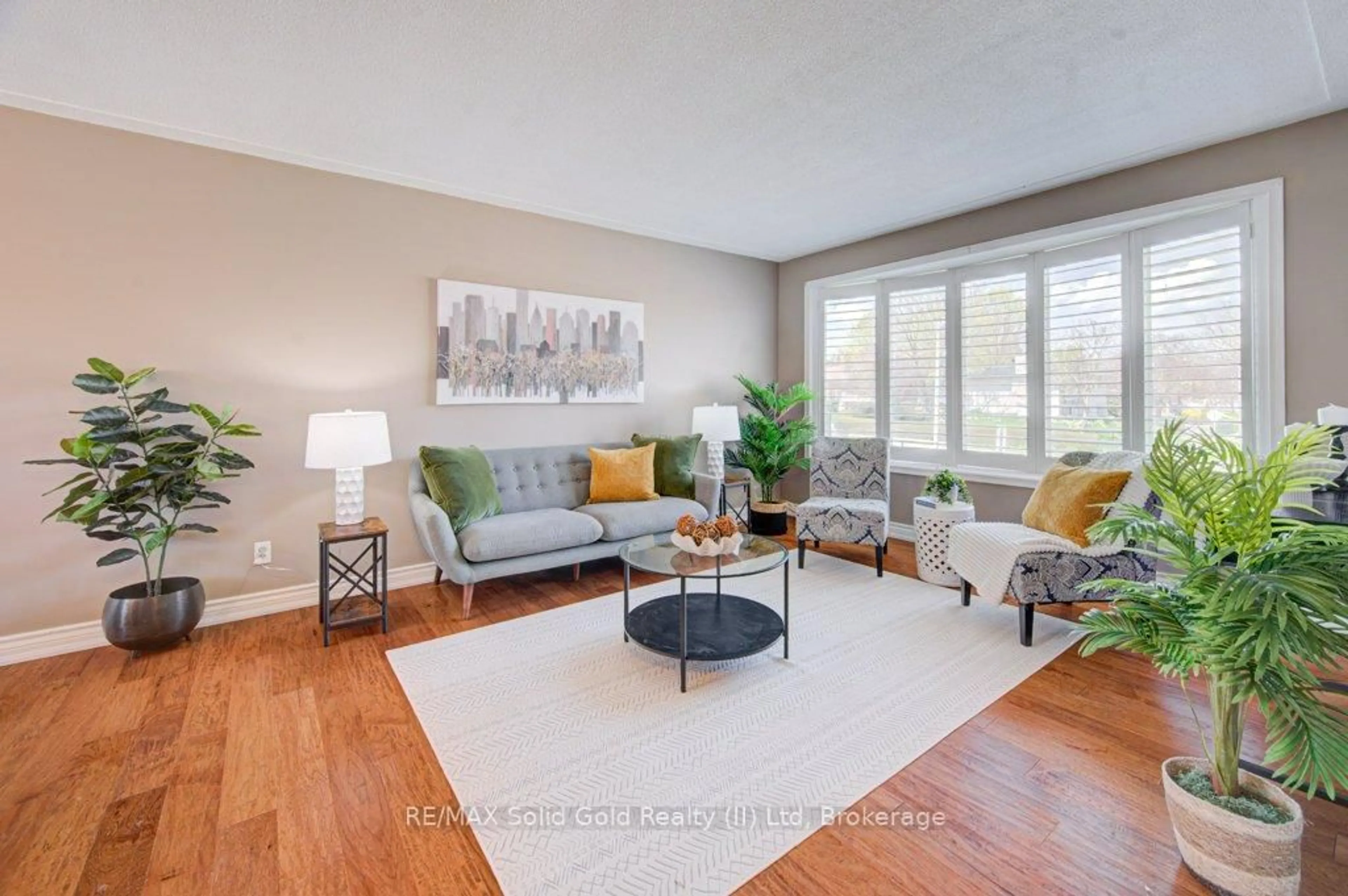 Living room with furniture, wood/laminate floor for 682 Glen Forrest Blvd, Waterloo Ontario N2L 4K6