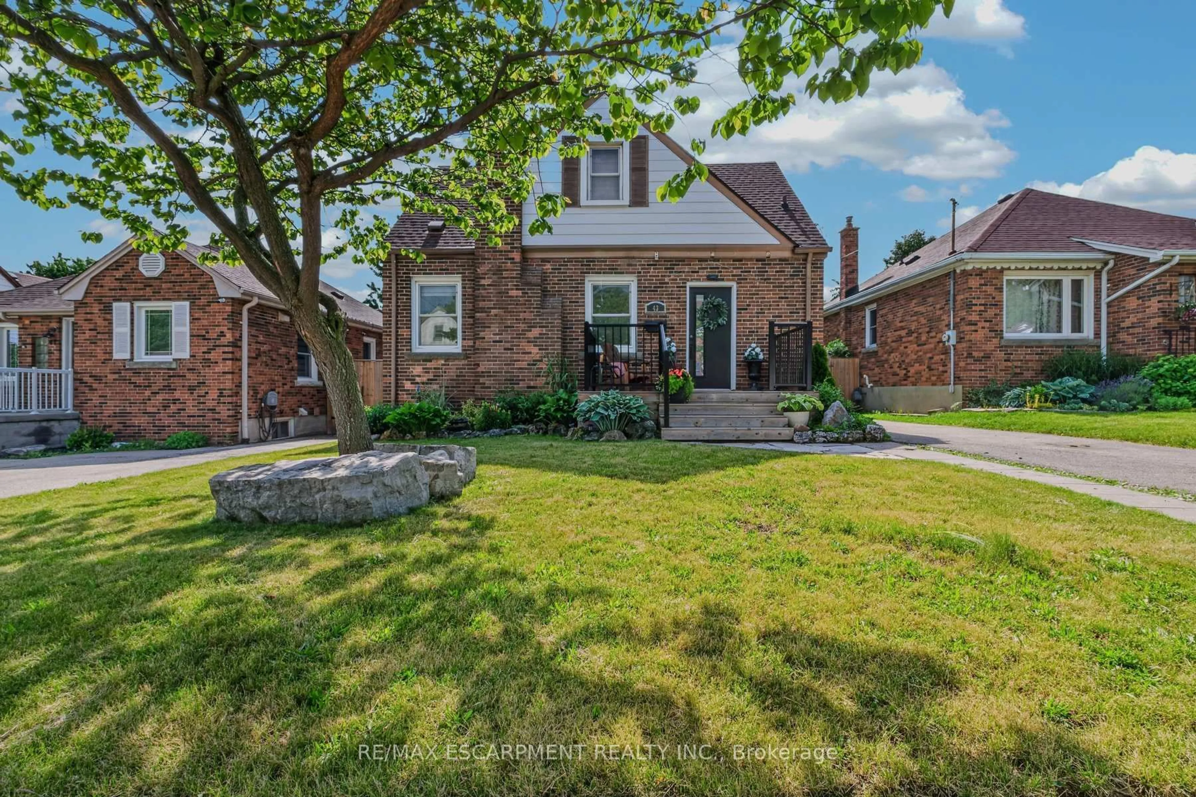 Home with brick exterior material, street for 43 Woodbridge Rd, Hamilton Ontario L8K 3C8