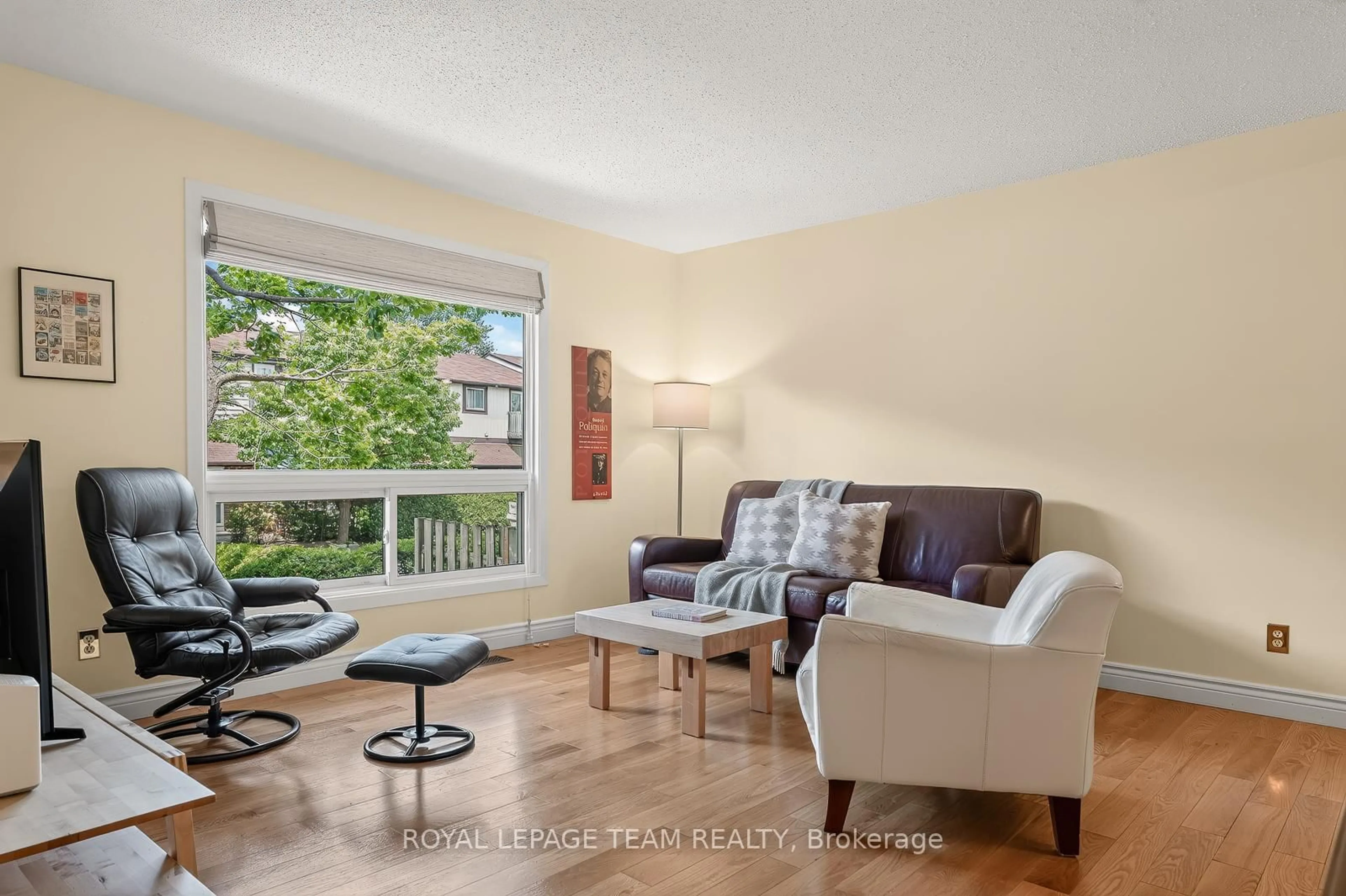 Living room with furniture, wood/laminate floor for 402 Montfort St #7, Ottawa Ontario K1L 8G7
