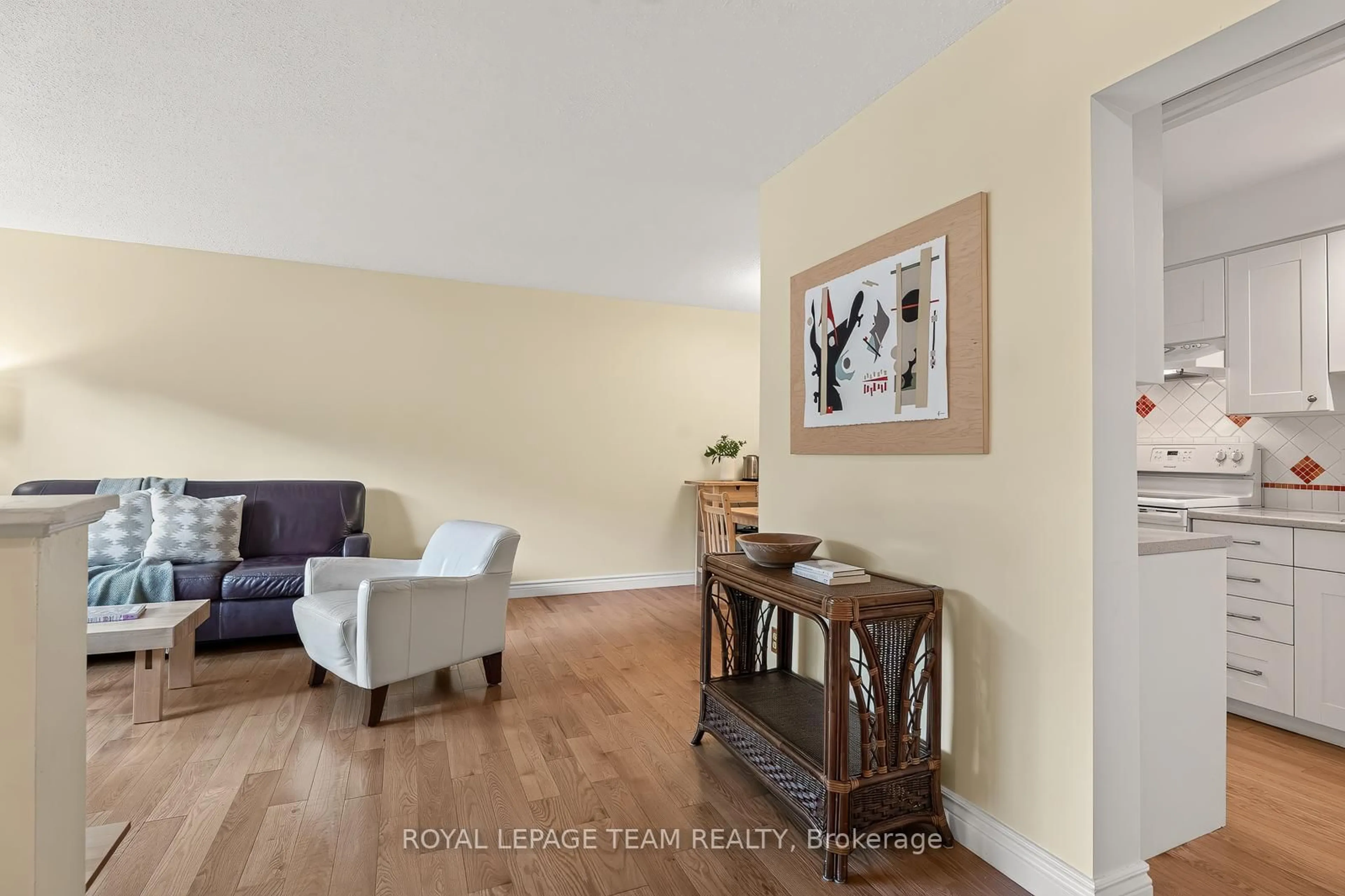Living room with furniture, wood/laminate floor for 402 Montfort St #7, Ottawa Ontario K1L 8G7