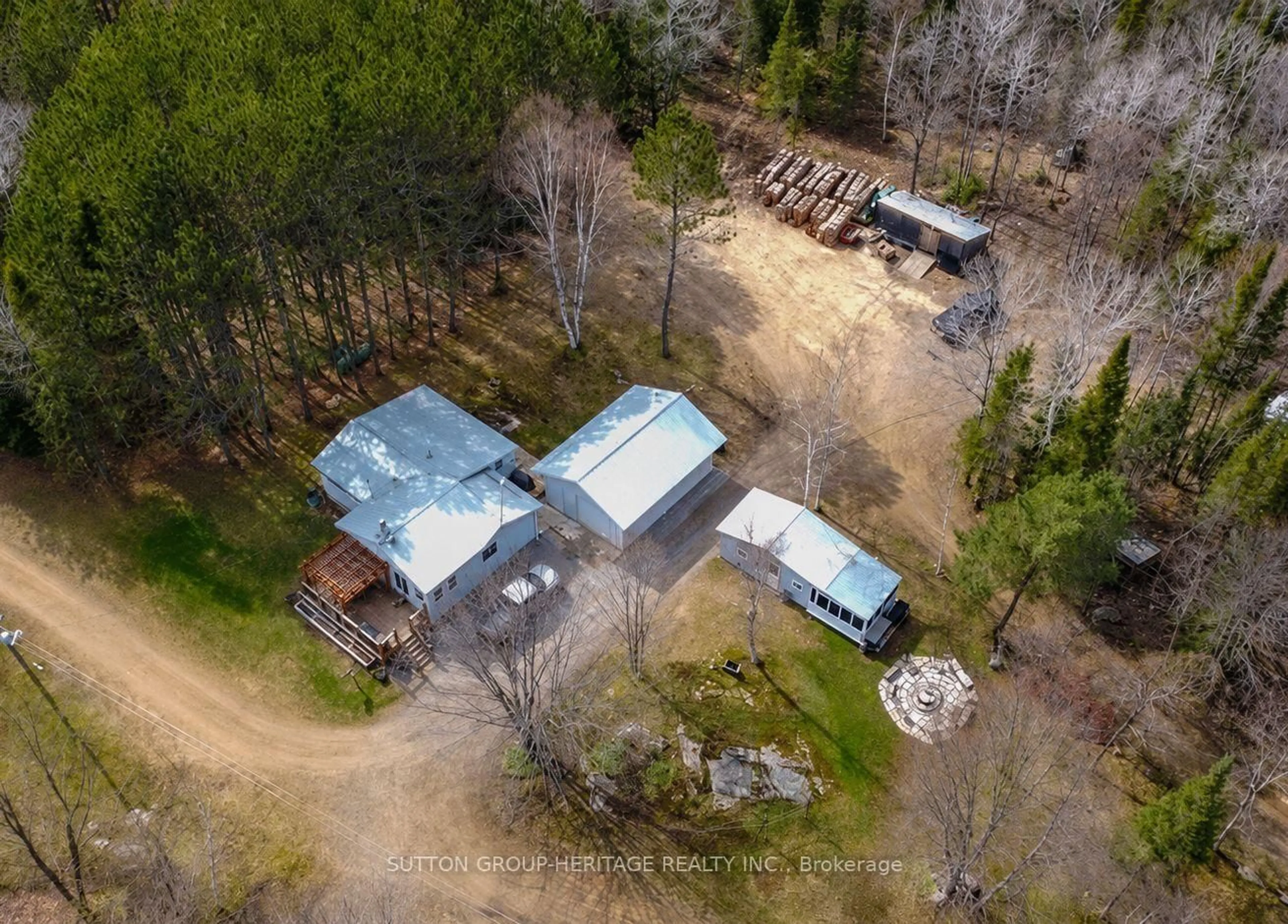 A pic from outside/outdoor area/front of a property/back of a property/a pic from drone, forest/trees view for 1241 One Mile Dr, Minden Hills Ontario K0M 2K0