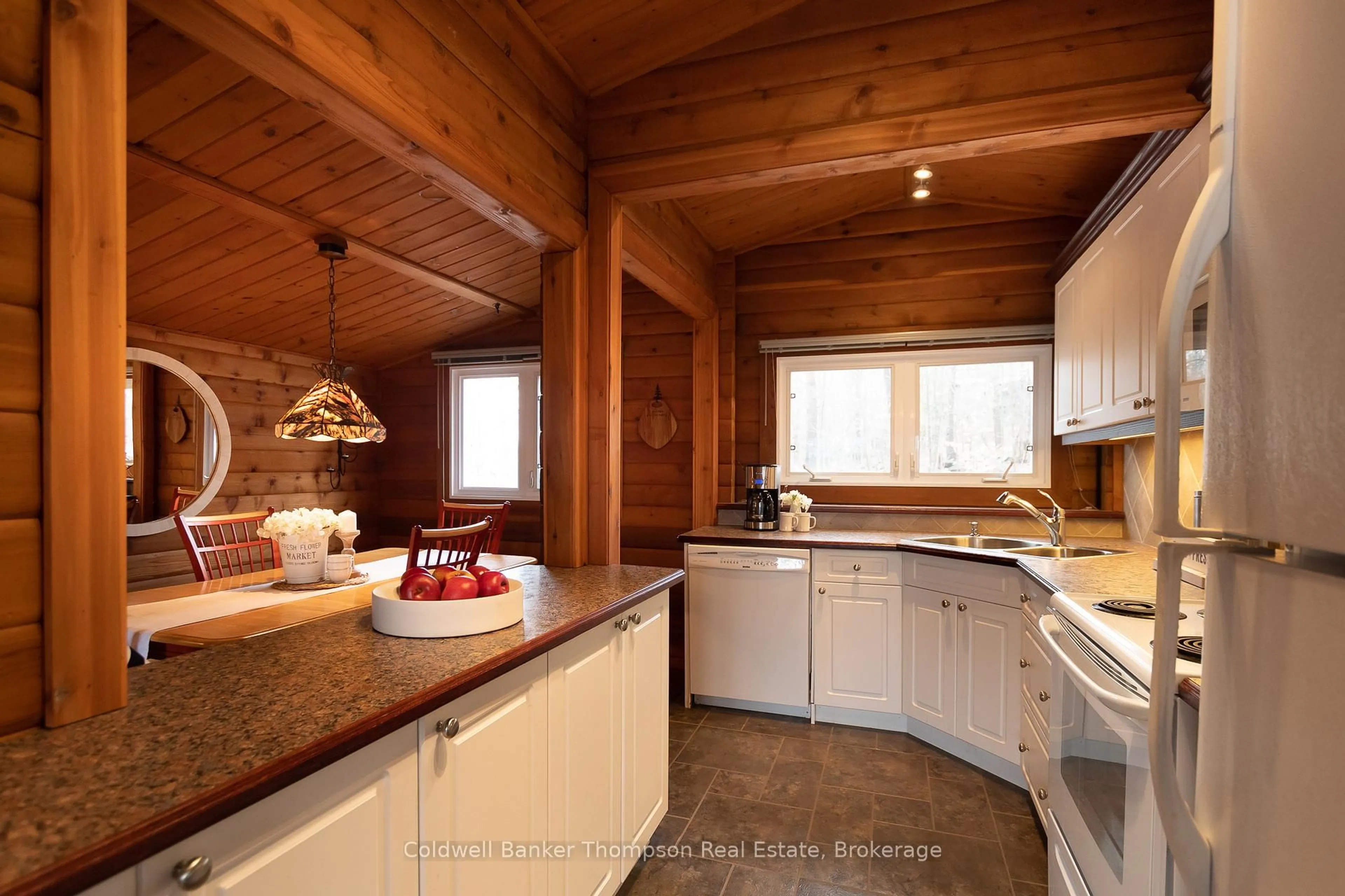 Rustic kitchen, wood/laminate floor for 1802 Valley Rd, Huntsville Ontario P1H 1A8