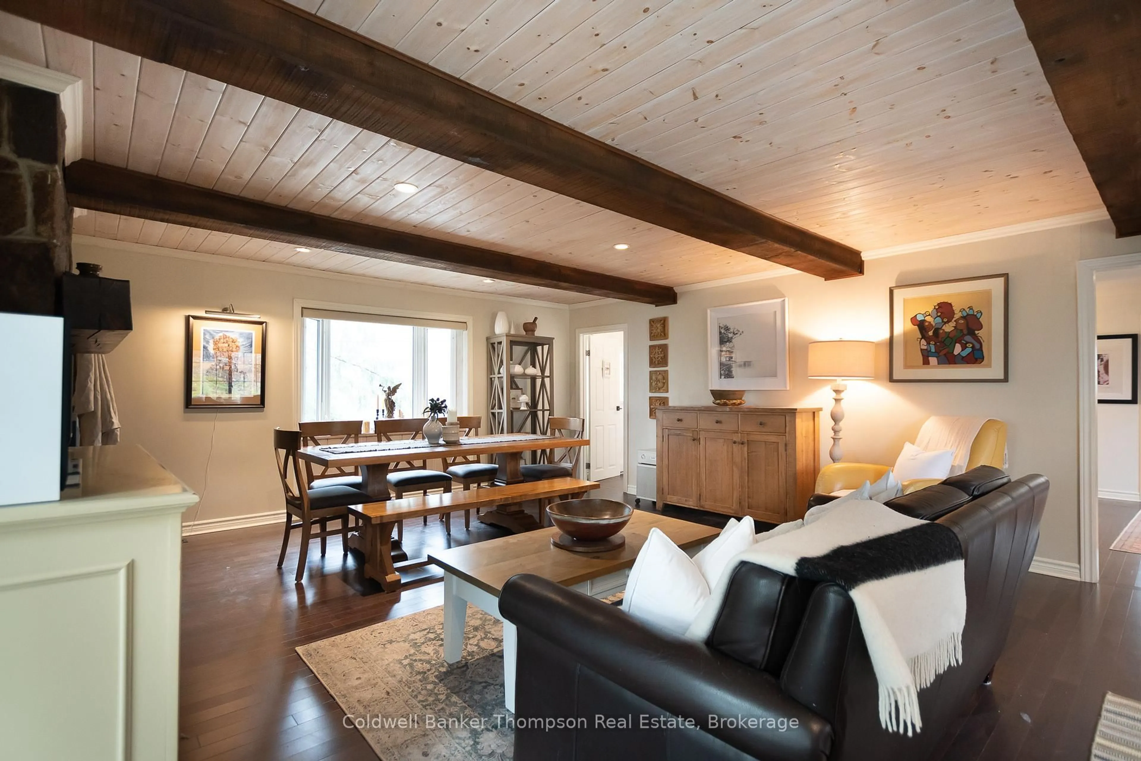 Living room with furniture, wood/laminate floor for 2-2802 Muskoka 118 Rd, Muskoka Lakes Ontario P0B 1J0
