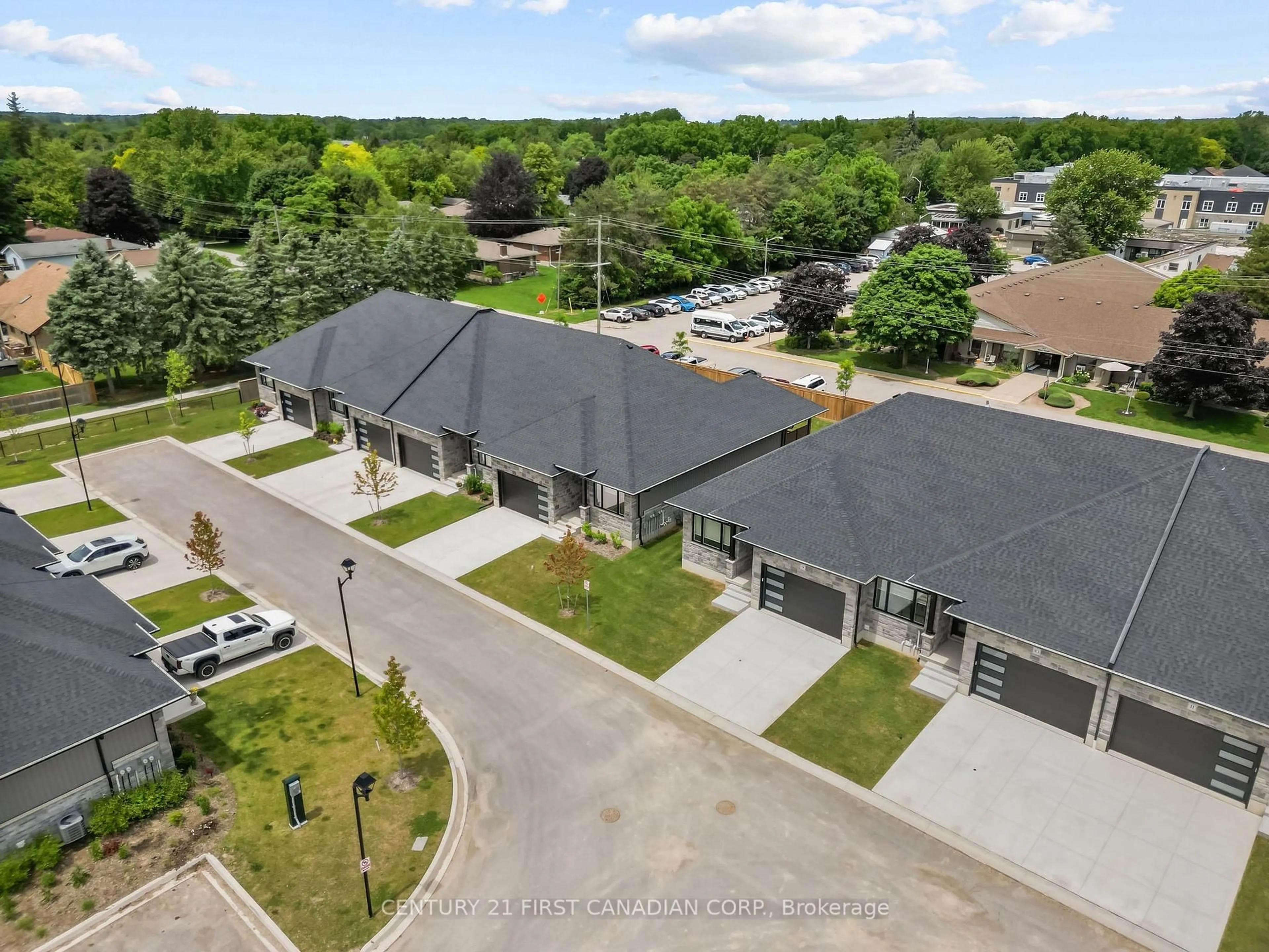A pic from outside/outdoor area/front of a property/back of a property/a pic from drone, street for 32 Postma Cres #12, North Middlesex Ontario N0M 1A0