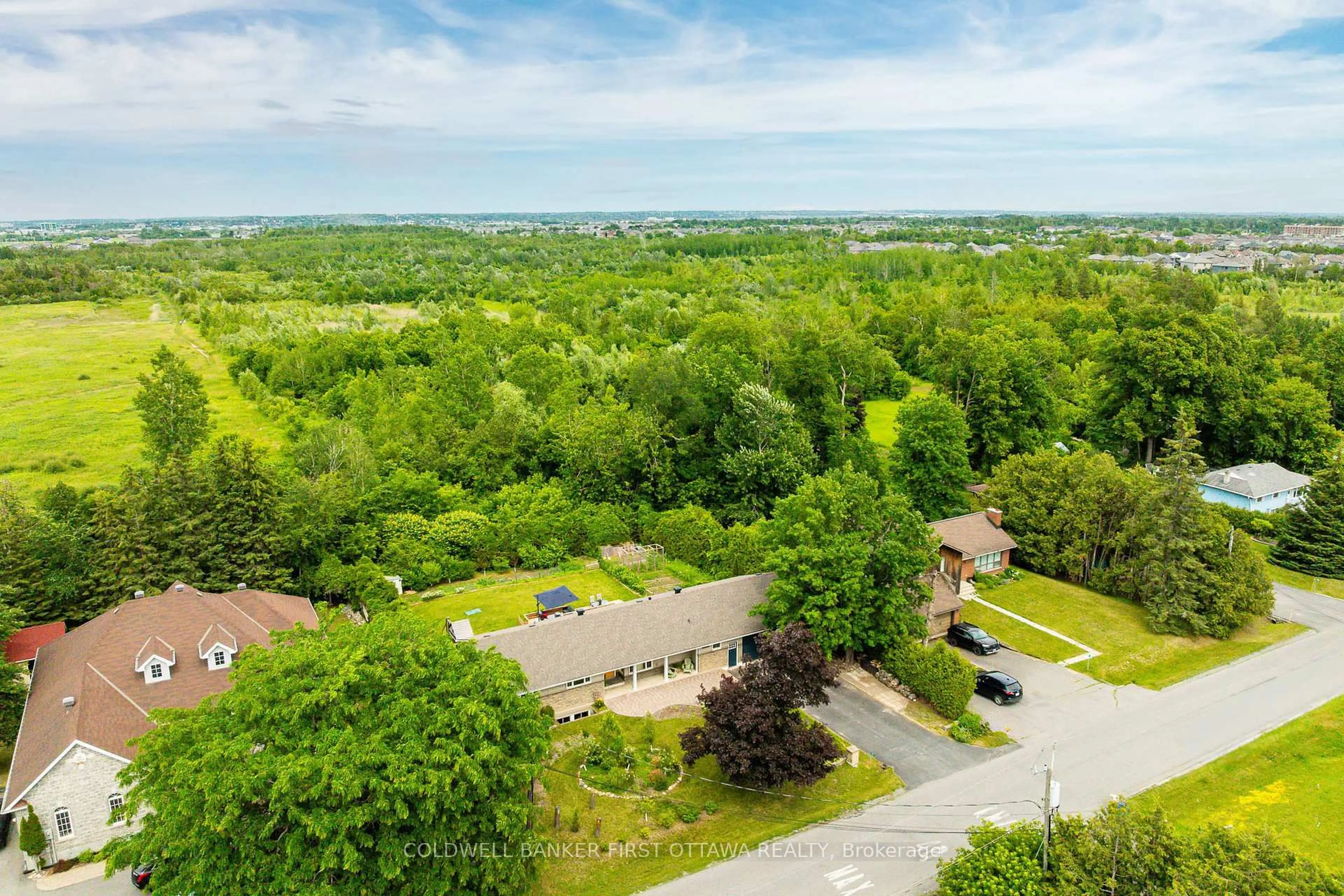 A pic from outside/outdoor area/front of a property/back of a property/a pic from drone, forest/trees view for 174 Lloydalex Cres, Carp Ontario K0A 1L0