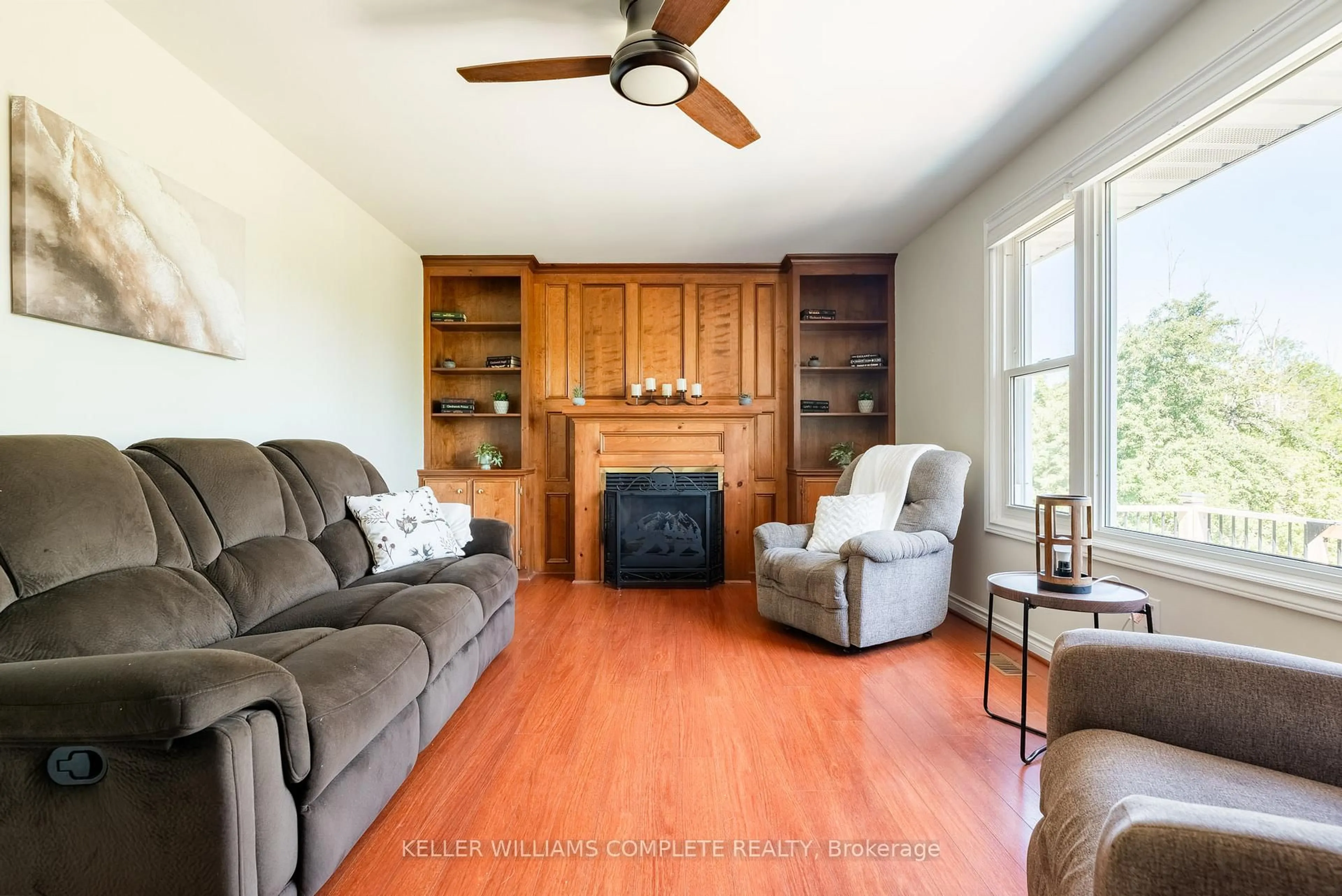 Living room with furniture, wood/laminate floor for 3486 East Main St, Fort Erie Ontario L0S 1S0
