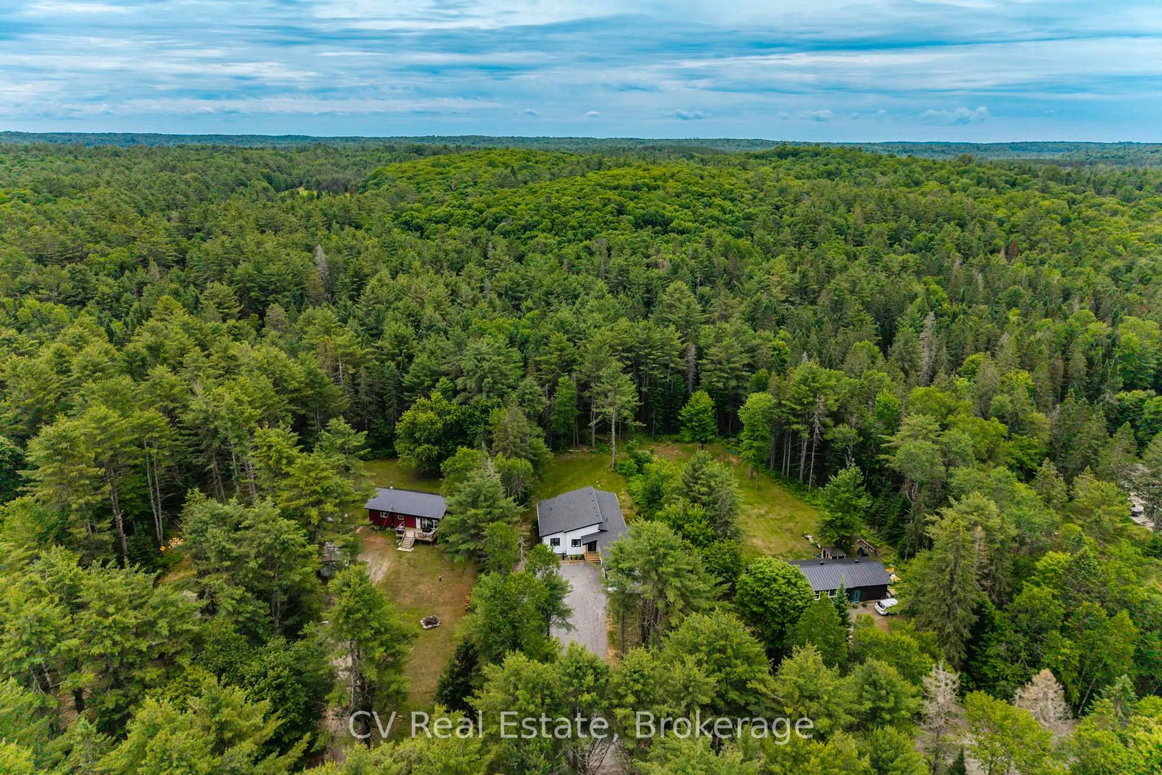 A pic from outside/outdoor area/front of a property/back of a property/a pic from drone, forest/trees view for 546 Balsam Chutes Rd, Huntsville Ontario P0B 1L0