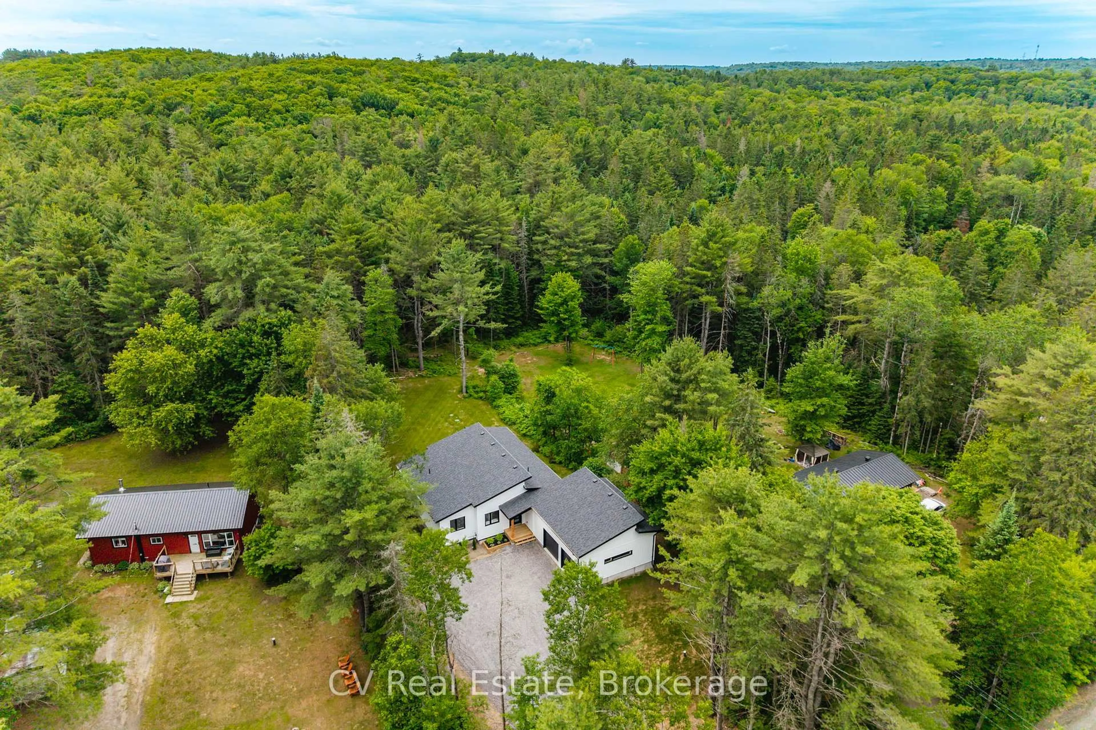 A pic from outside/outdoor area/front of a property/back of a property/a pic from drone, forest/trees view for 546 Balsam Chutes Rd, Huntsville Ontario P0B 1L0