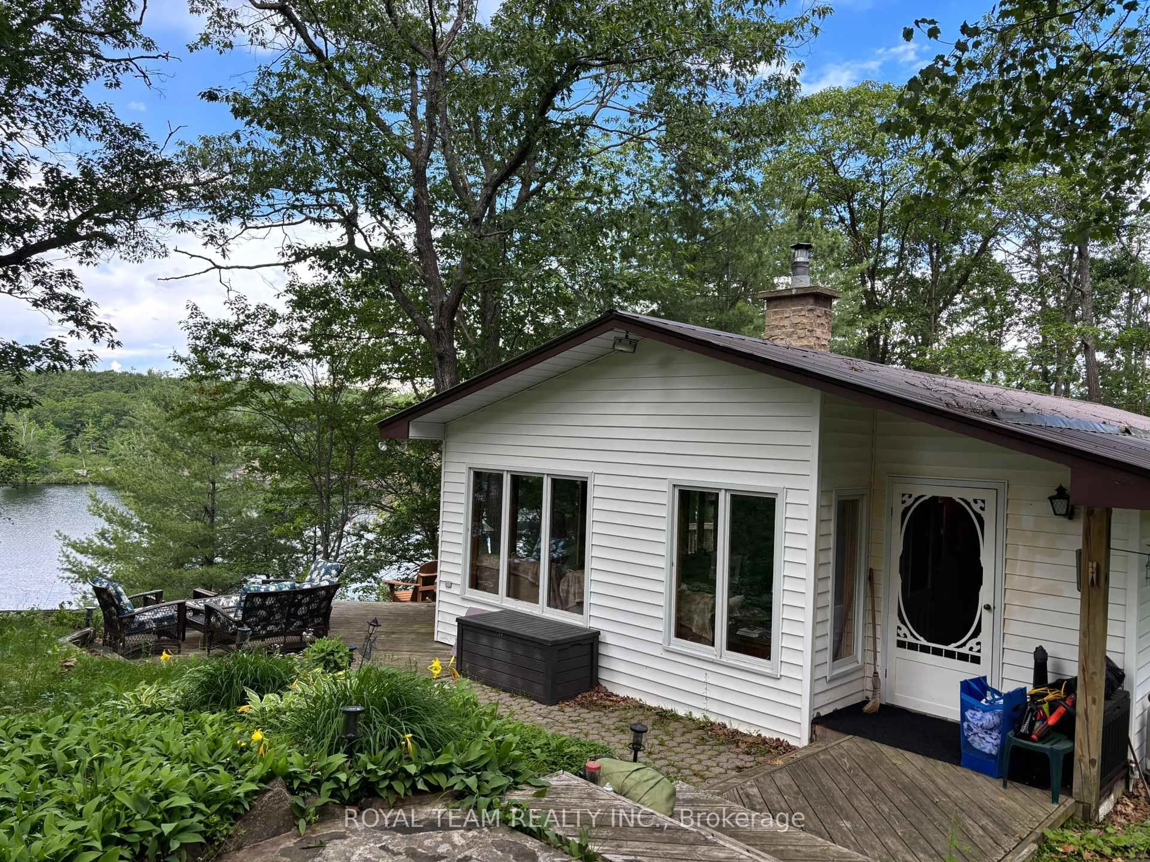 A pic from outside/outdoor area/front of a property/back of a property/a pic from drone, water/lake/river/ocean view for 1851 DEEP BAY Rd, Minden Hills Ontario K0M 2L1
