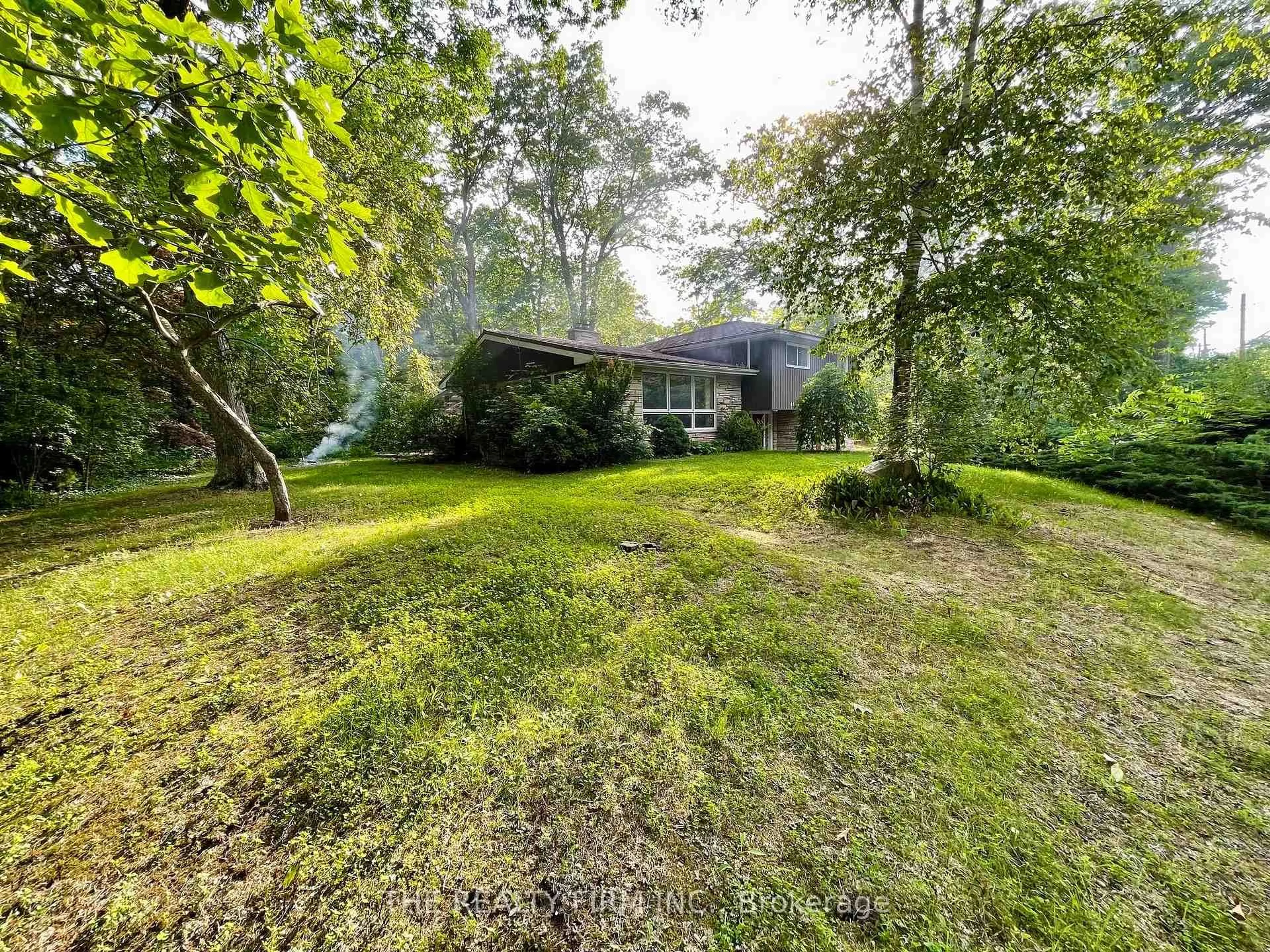 A pic from outside/outdoor area/front of a property/back of a property/a pic from drone, forest/trees view for 48 Lake Rd, Lambton Shores Ontario N0M 1T0