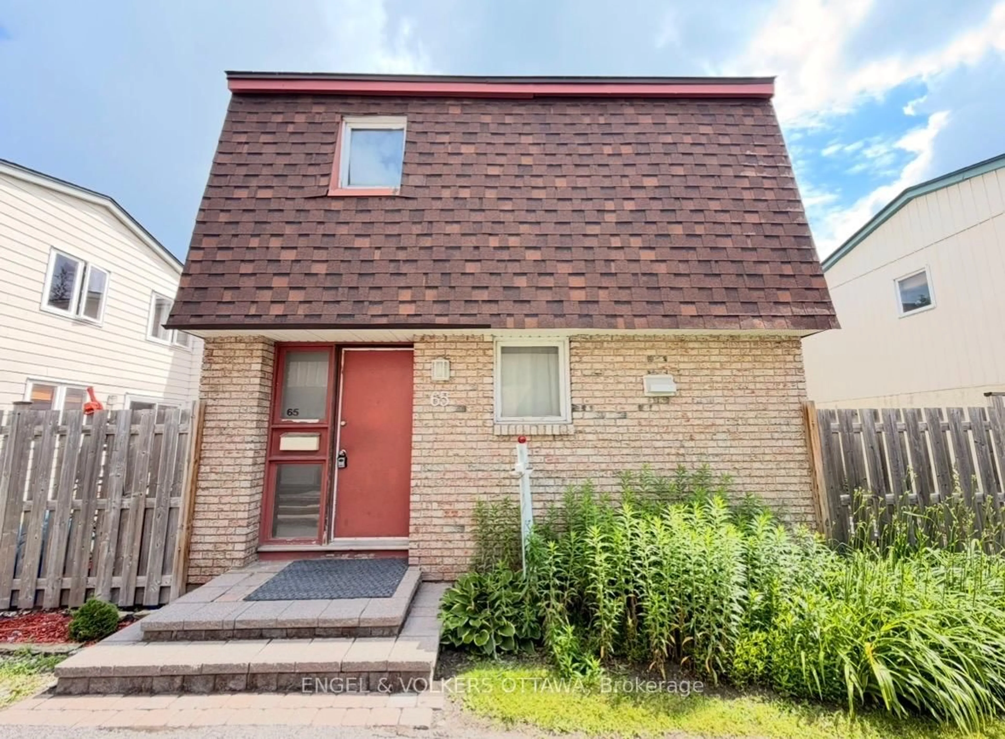 Home with brick exterior material, street for 2063 Jasmine Cres #65, Ottawa Ontario K1J 7W2