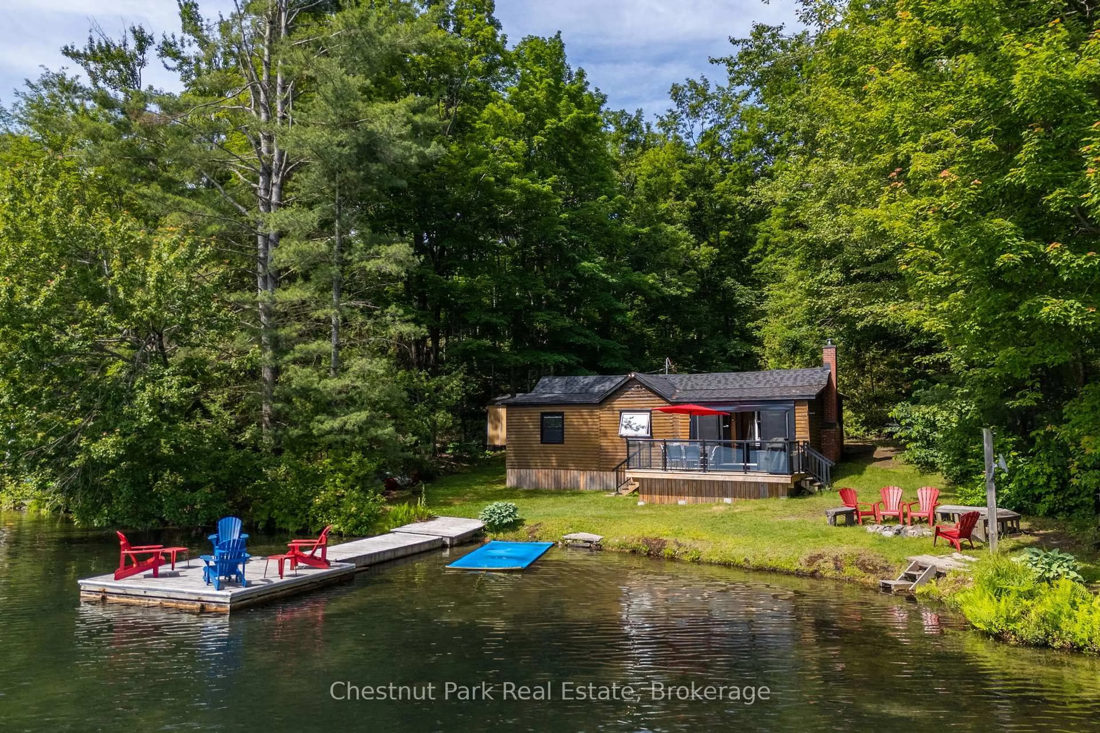 A pic from outside/outdoor area/front of a property/back of a property/a pic from drone, water/lake/river/ocean view for 1143 Ridge Rd #3, Muskoka Lakes Ontario P0C 1M0
