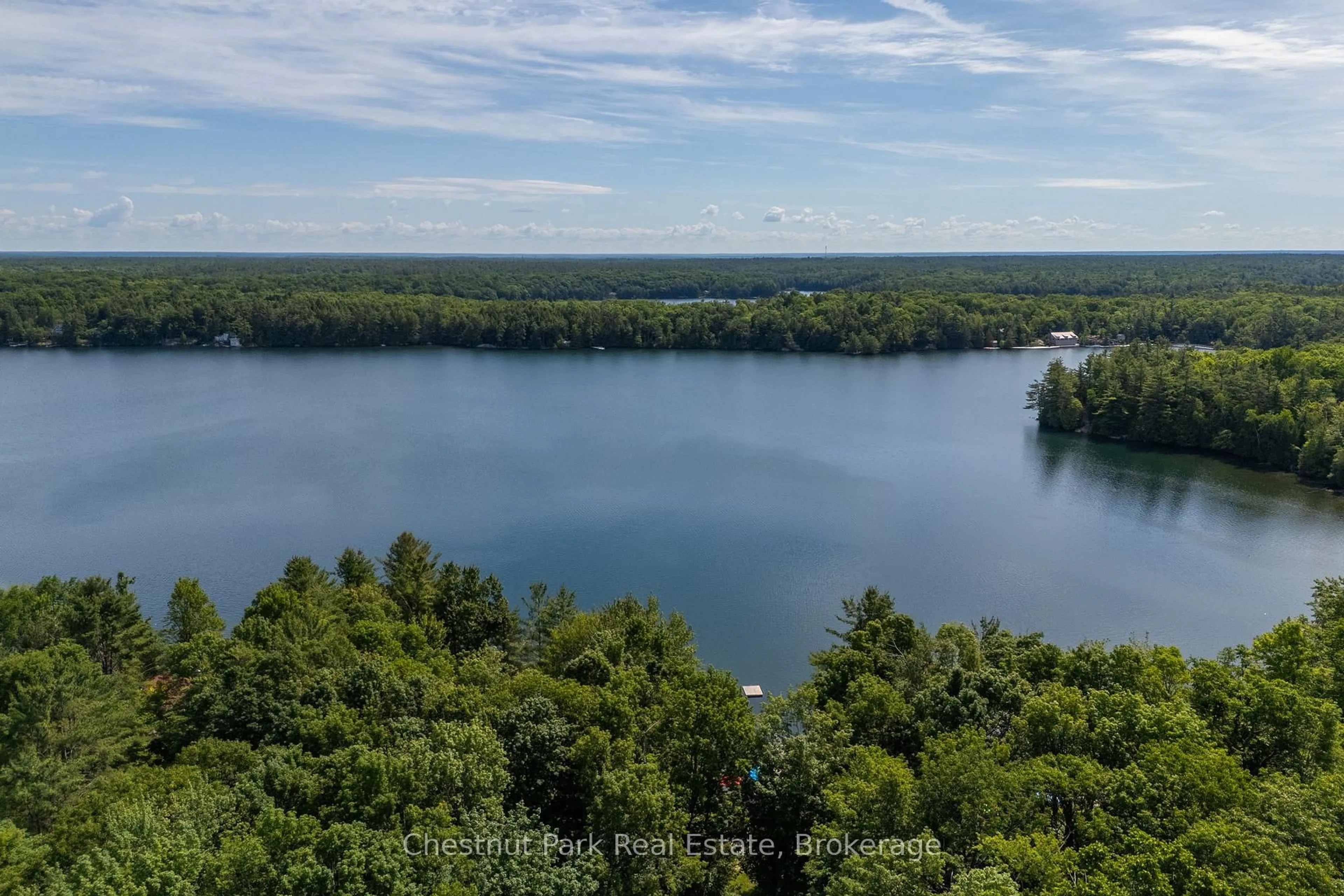 A pic from outside/outdoor area/front of a property/back of a property/a pic from drone, water/lake/river/ocean view for 1143 Ridge Rd #3, Muskoka Lakes Ontario P0C 1M0