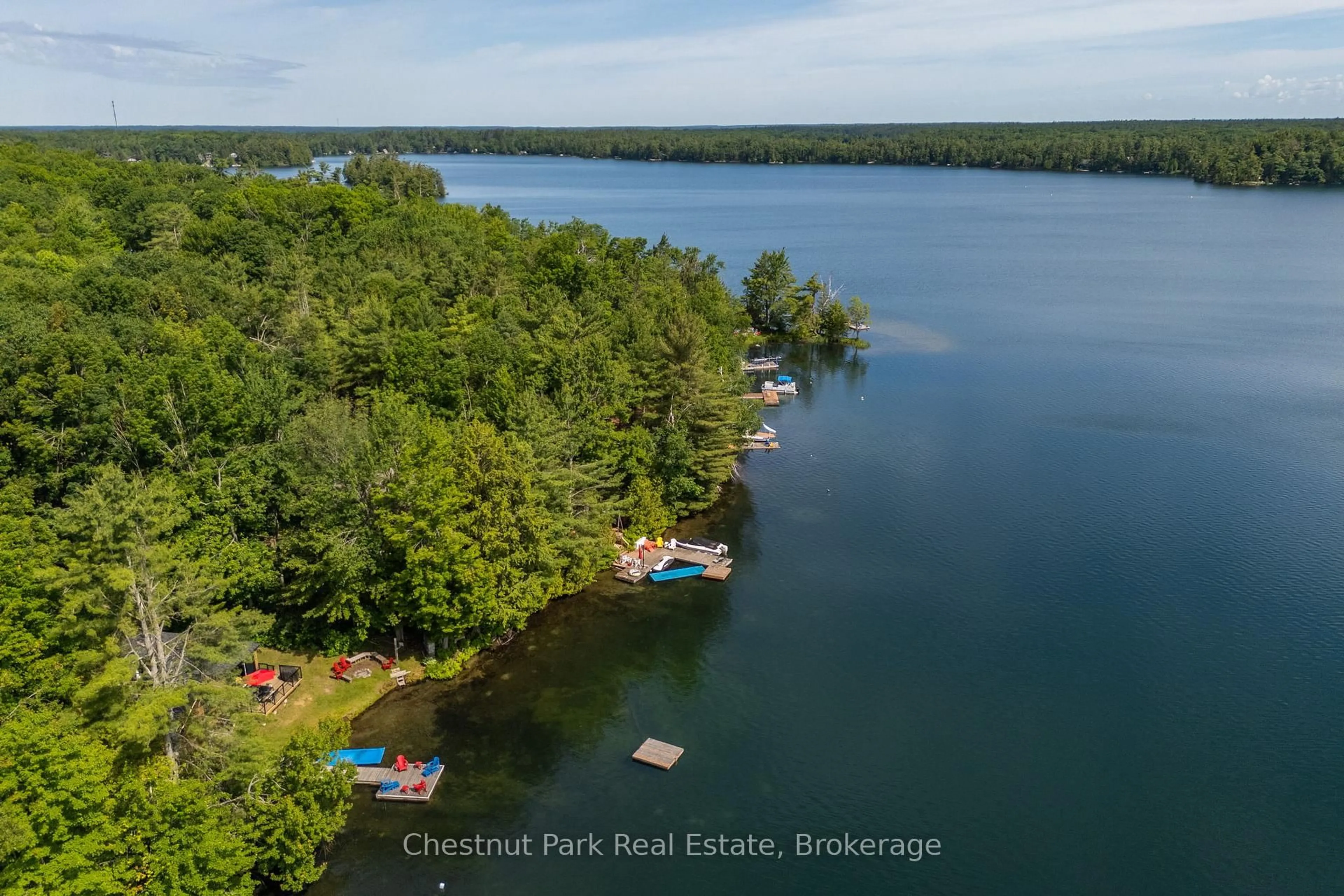 A pic from outside/outdoor area/front of a property/back of a property/a pic from drone, water/lake/river/ocean view for 1143 Ridge Rd #3, Muskoka Lakes Ontario P0C 1M0