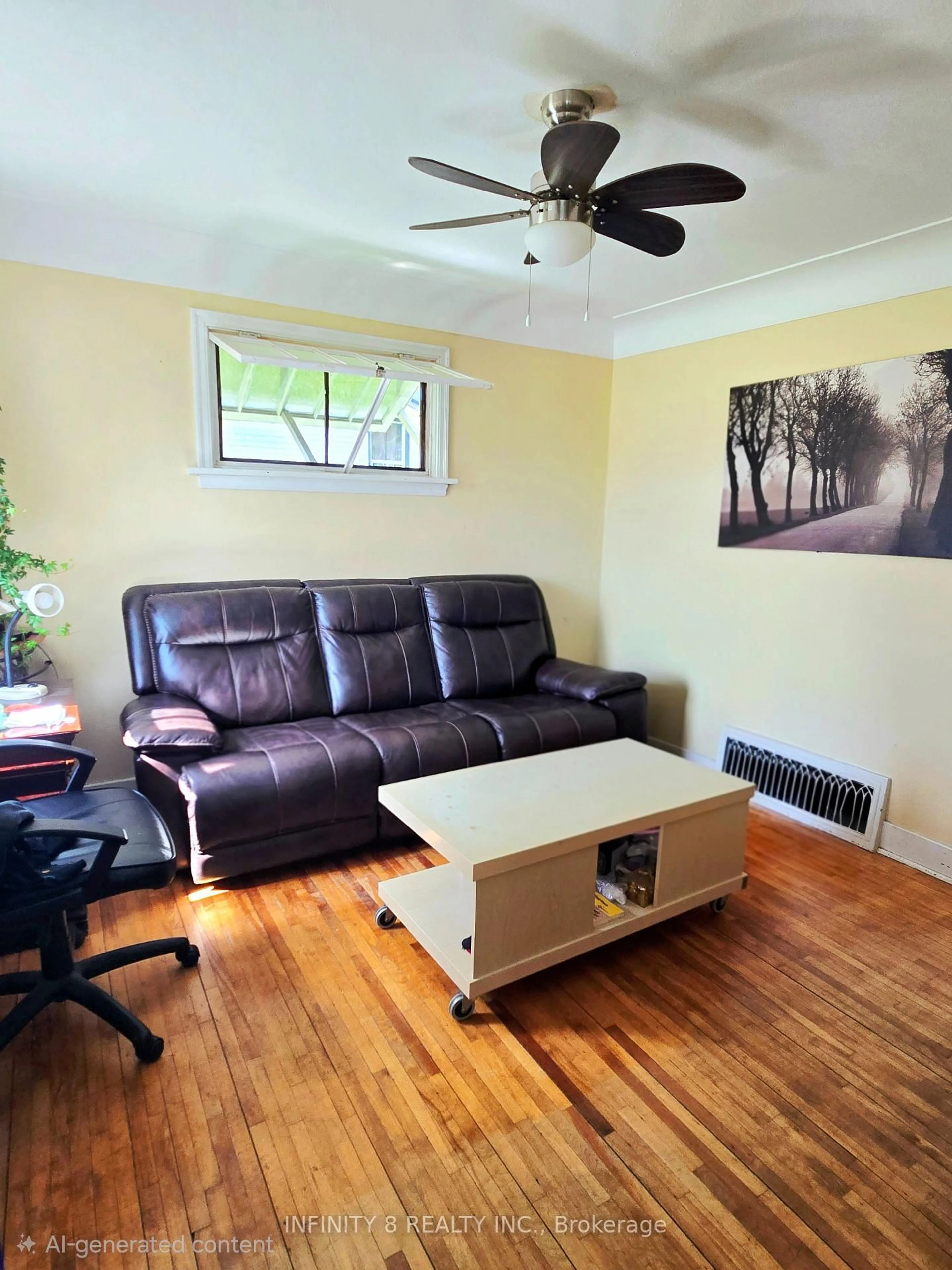 Living room with furniture, wood/laminate floor for 98 Louth St, St. Catharines Ontario L2S 2T4