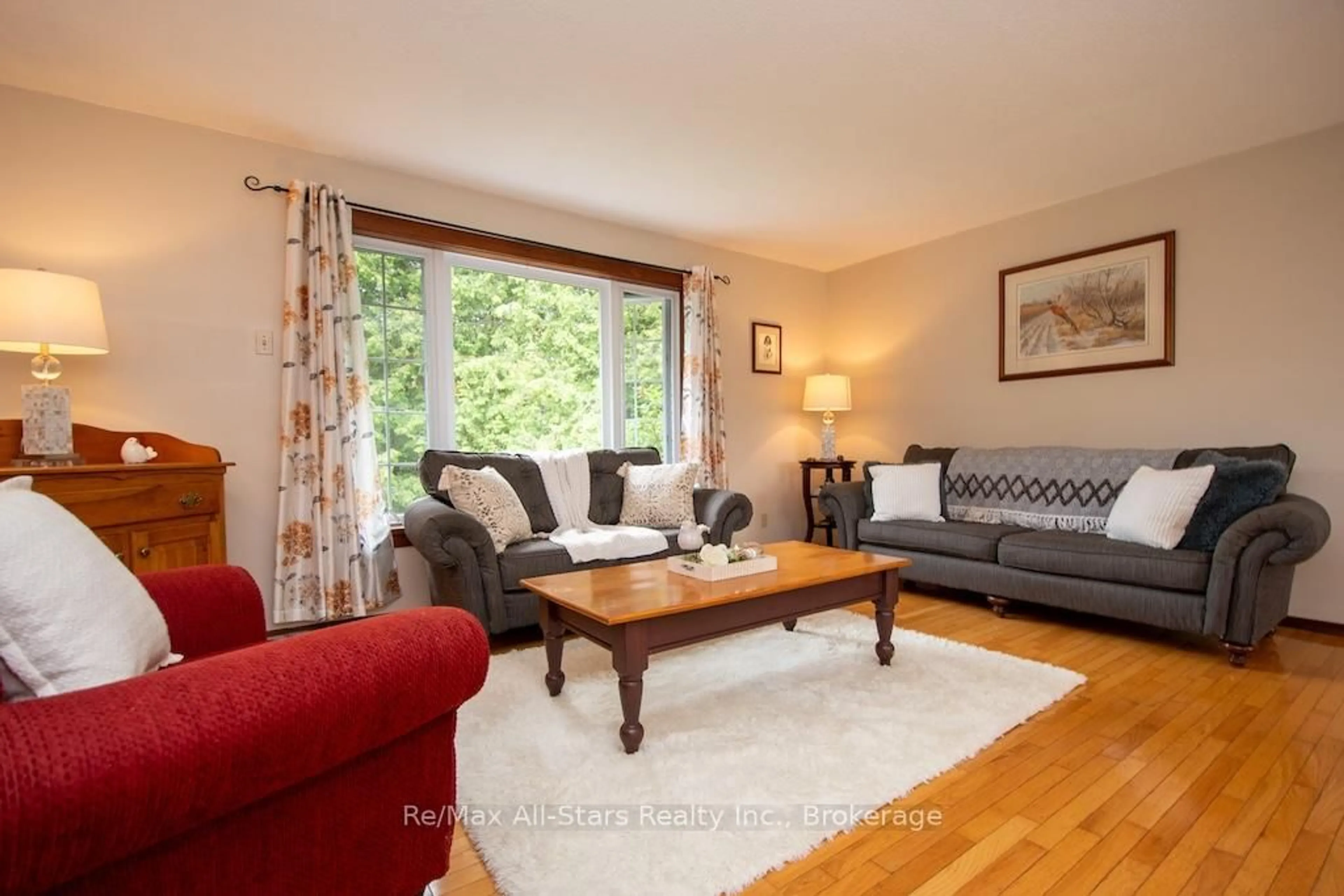 Living room with furniture, wood/laminate floor for 421 Ogemah Rd, Kawartha Lakes Ontario K0M 2C0