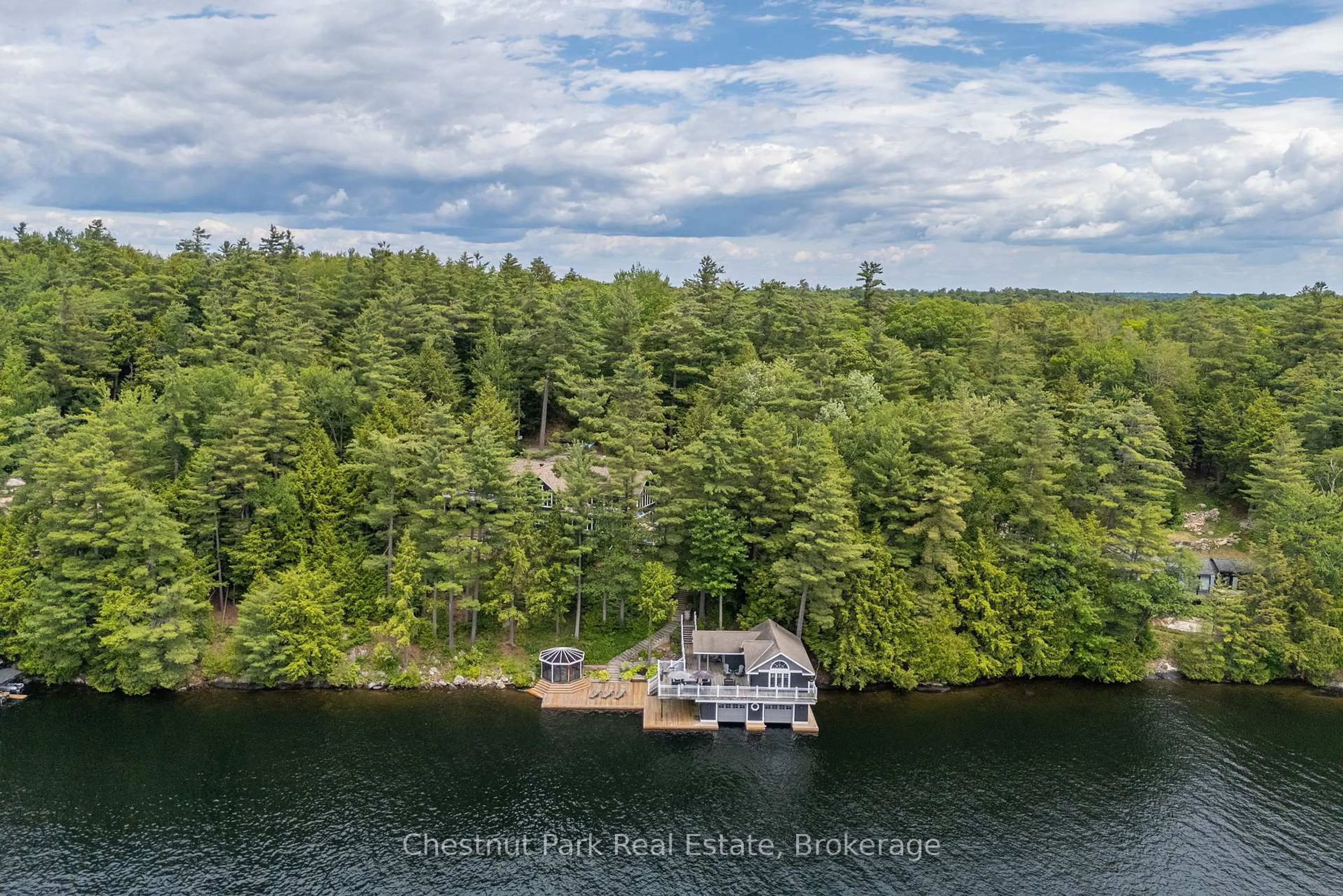 A pic from outside/outdoor area/front of a property/back of a property/a pic from drone, water/lake/river/ocean view for 1077 HAMILLS POINT Rd, Muskoka Lakes Ontario P0B 1J0