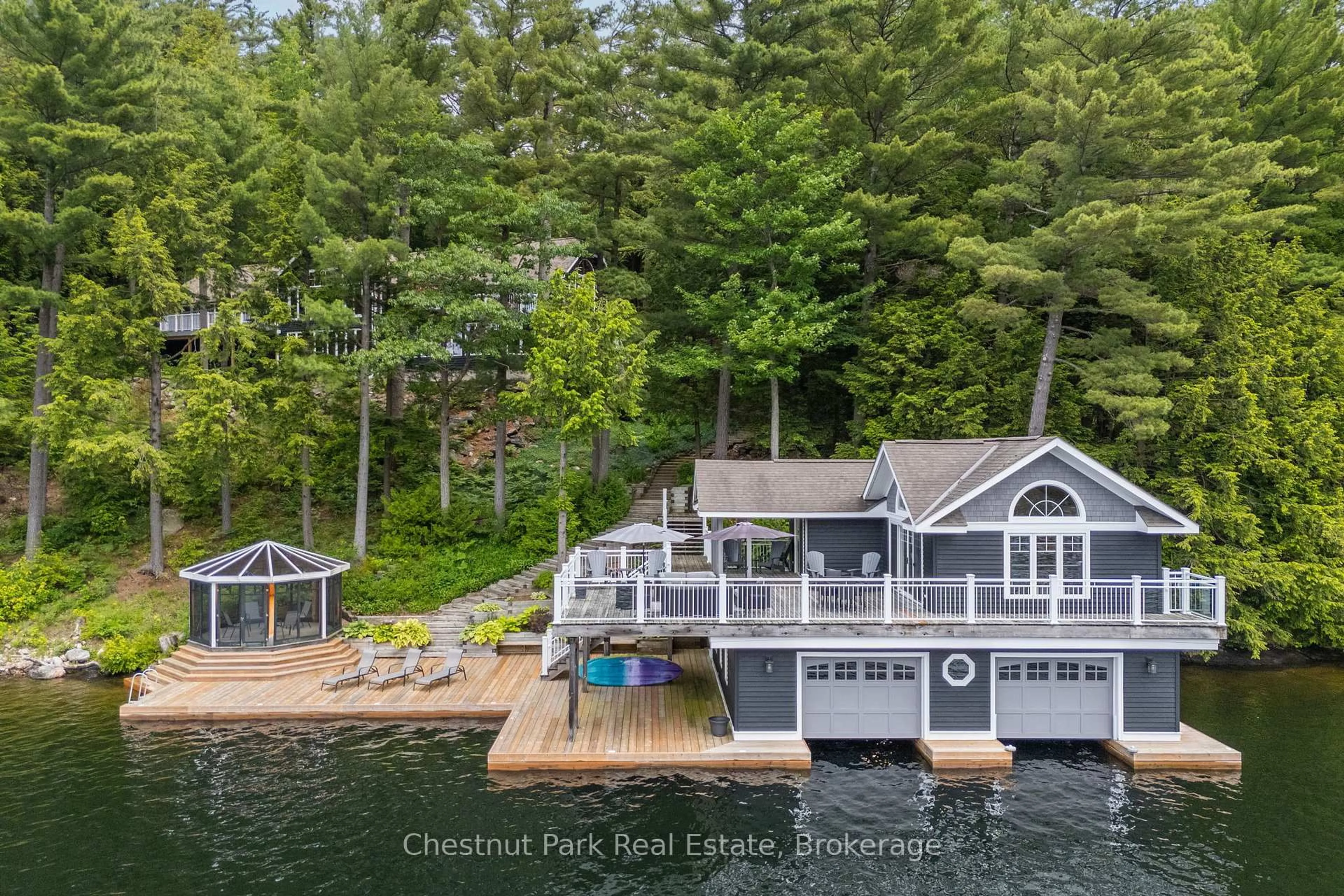 A pic from outside/outdoor area/front of a property/back of a property/a pic from drone, water/lake/river/ocean view for 1077 HAMILLS POINT Rd, Muskoka Lakes Ontario P0B 1J0