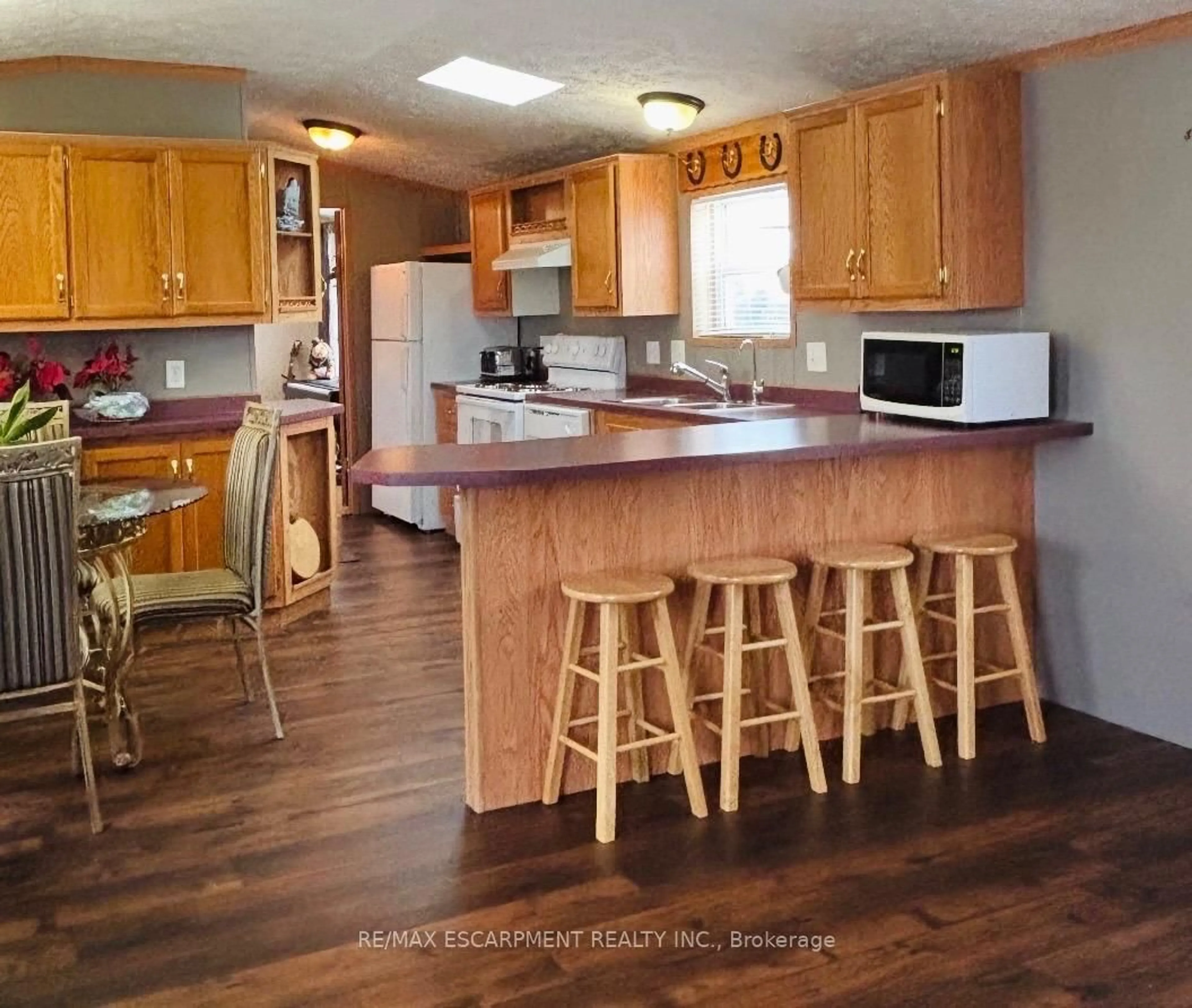Open concept kitchen, wood/laminate floor for 1294 8th Concession Rd #31, Hamilton Ontario N0B 2J0