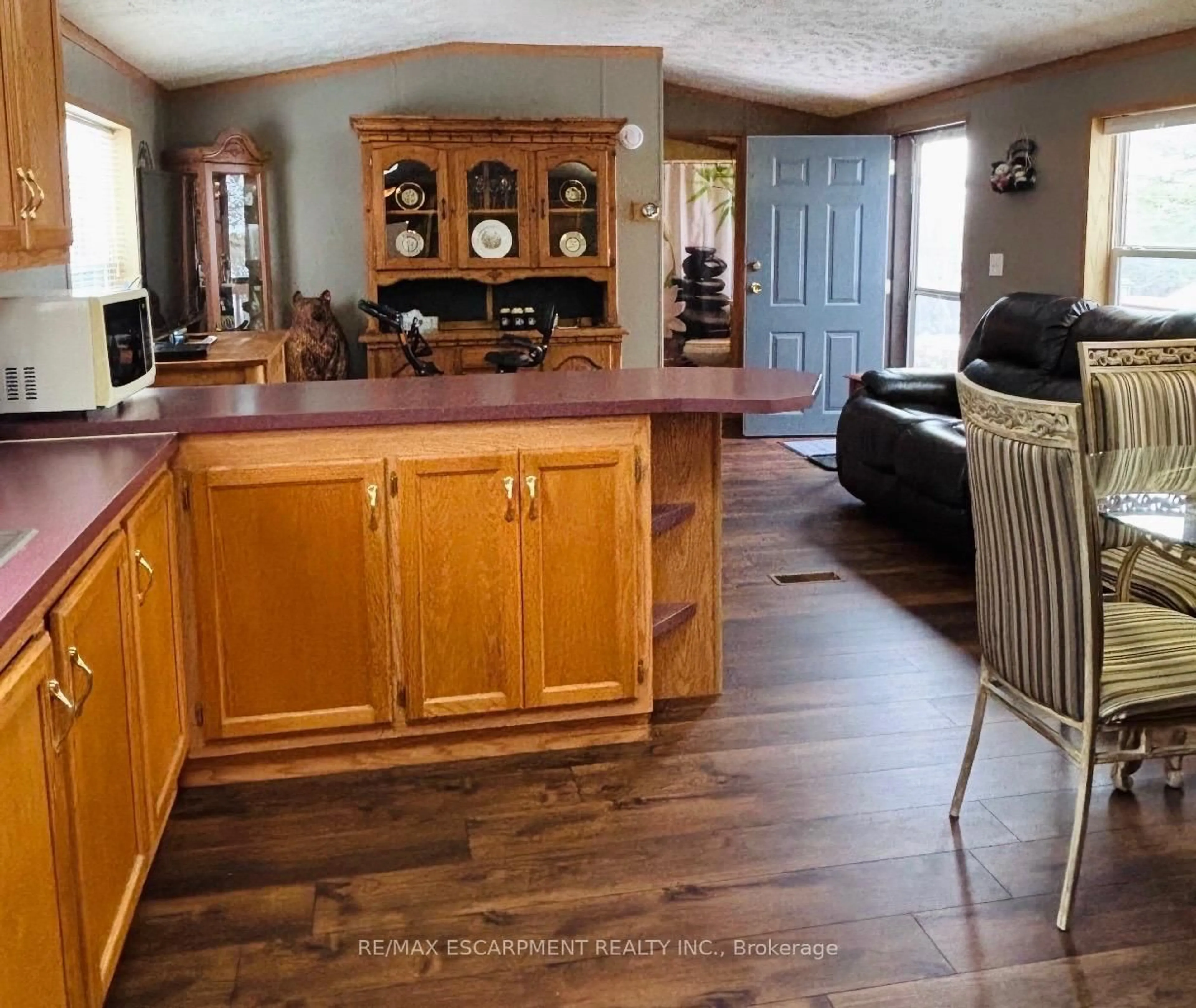 Open concept kitchen, wood/laminate floor for 1294 8th Concession Rd #31, Hamilton Ontario N0B 2J0
