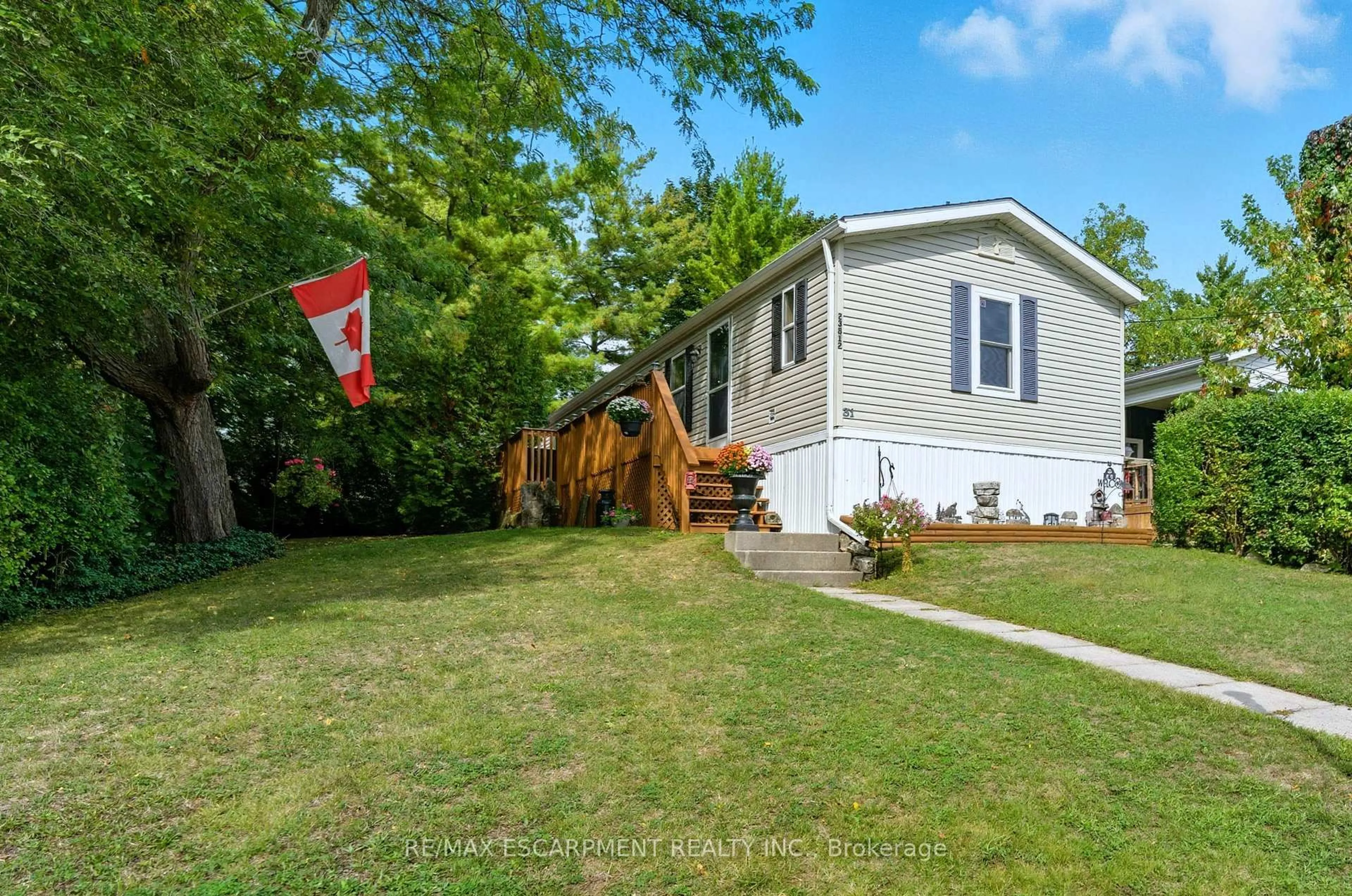 A pic from outside/outdoor area/front of a property/back of a property/a pic from drone, street for 1294 8th Concession Rd #31, Hamilton Ontario N0B 2J0