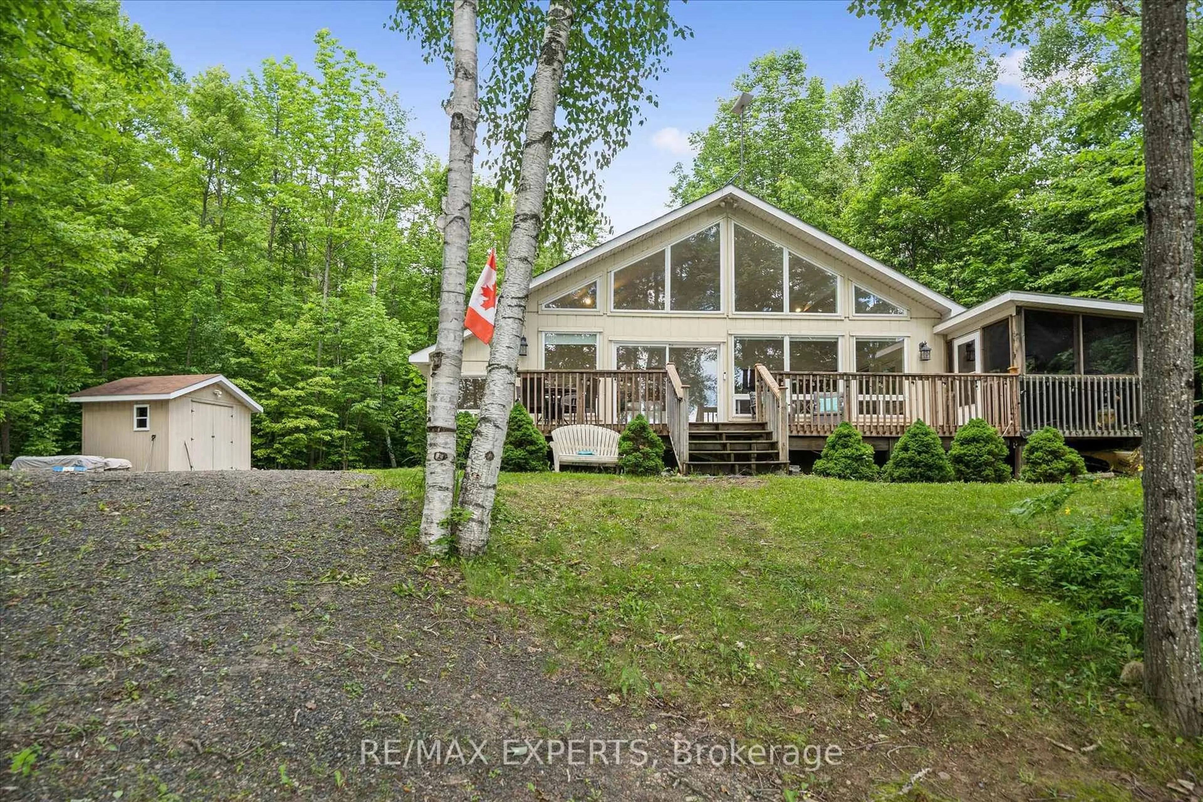 A pic from outside/outdoor area/front of a property/back of a property/a pic from drone, water/lake/river/ocean view for 1007 Mccabe Rd, Lake of Bays Ontario P0B 1A0