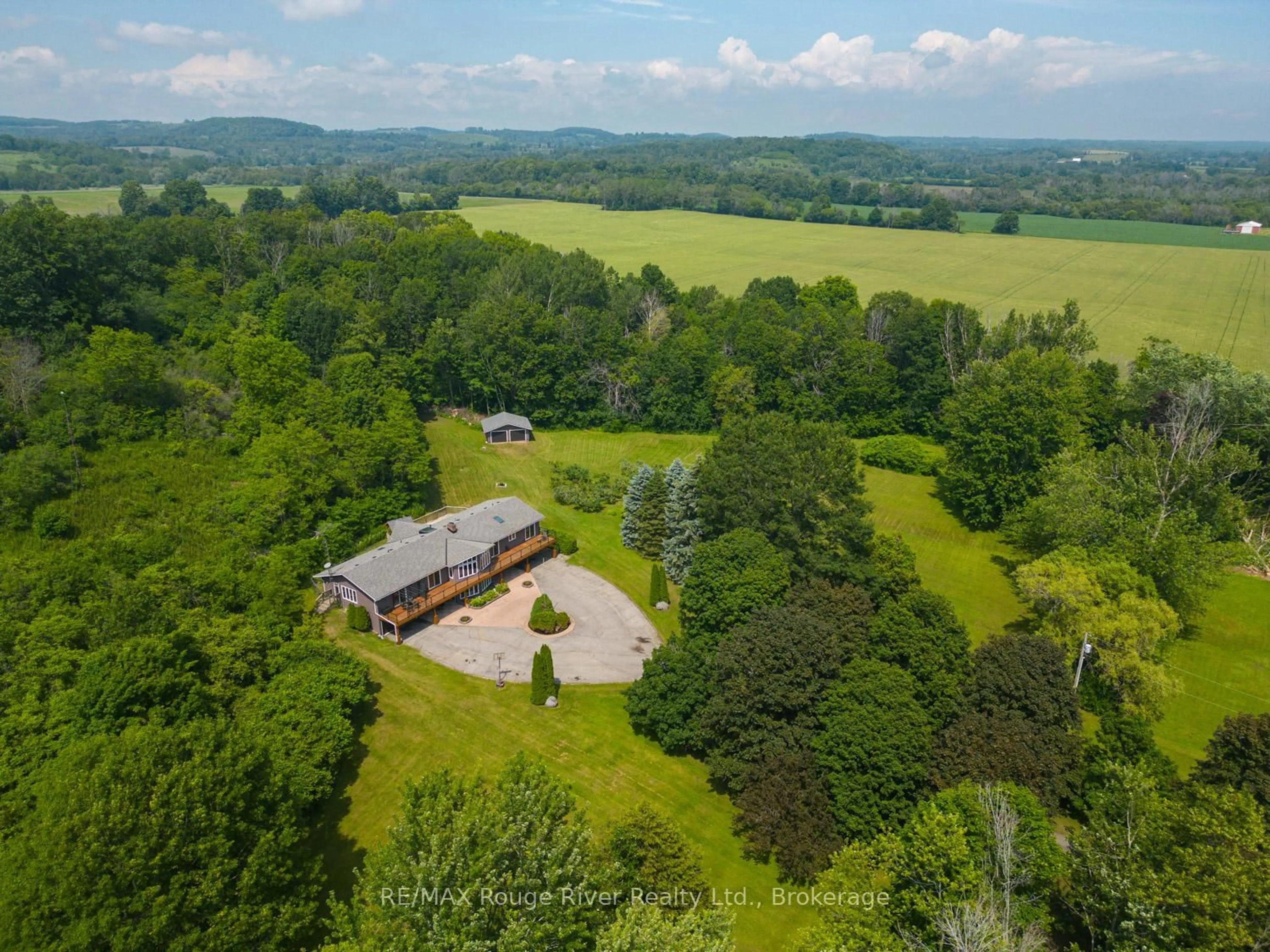 A pic from outside/outdoor area/front of a property/back of a property/a pic from drone, mountain view for 9780 County 2 Rd, Hamilton Township Ontario K9A 4J8