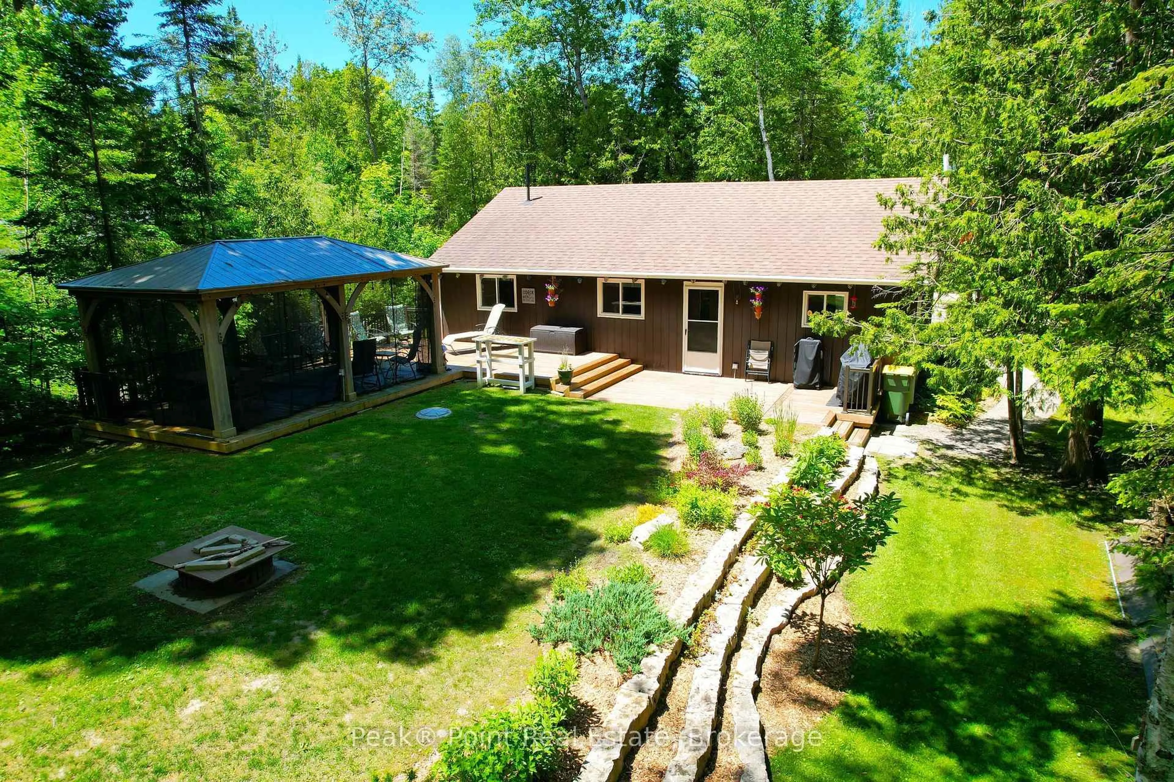 A pic from outside/outdoor area/front of a property/back of a property/a pic from drone, forest/trees view for 6 KAHGEE St, Native Leased Lands Ontario N0H 2G0
