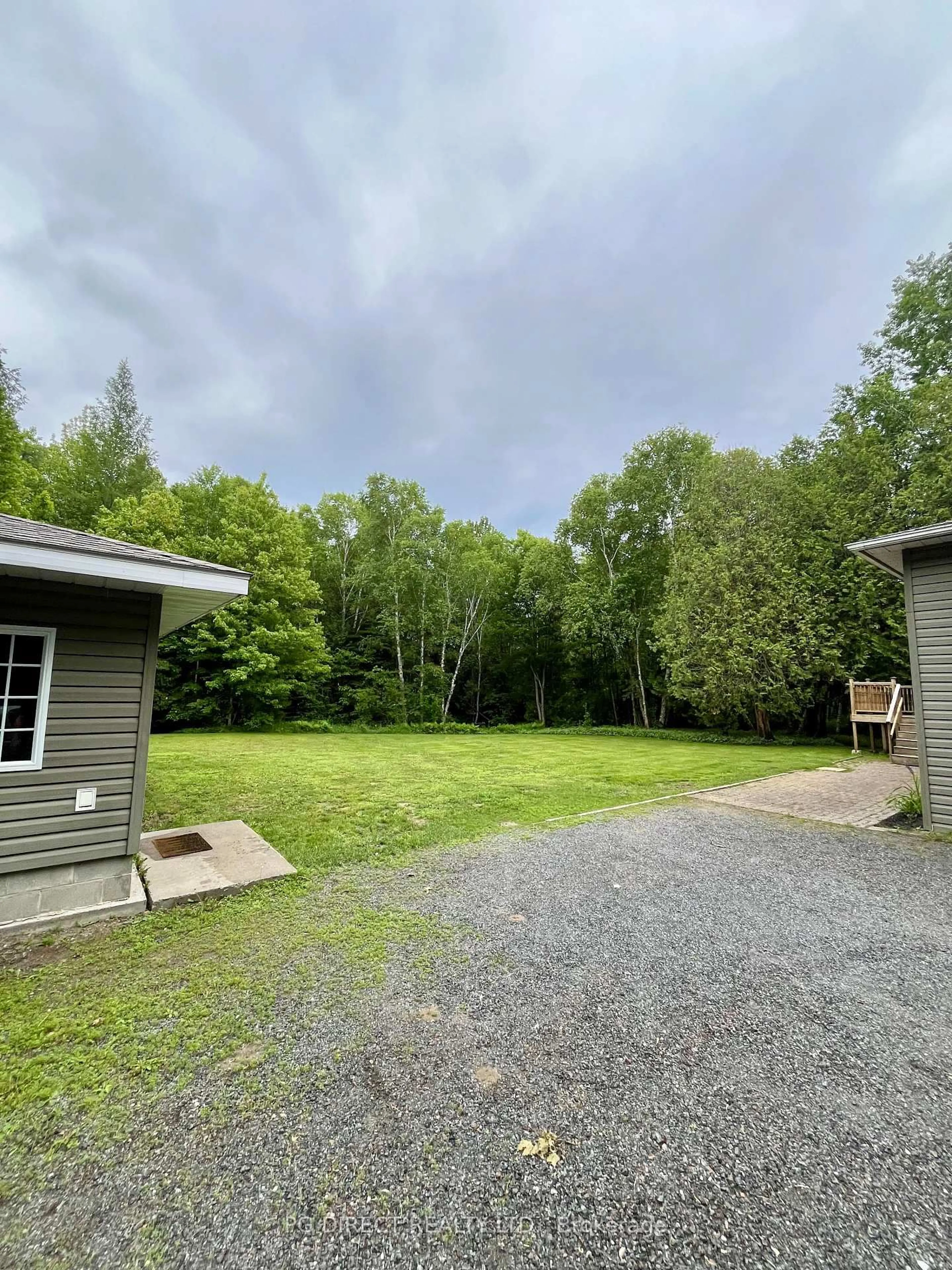 A pic from outside/outdoor area/front of a property/back of a property/a pic from drone, forest/trees view for 9 Marine Dr, Blind River Ontario P0R 1B0