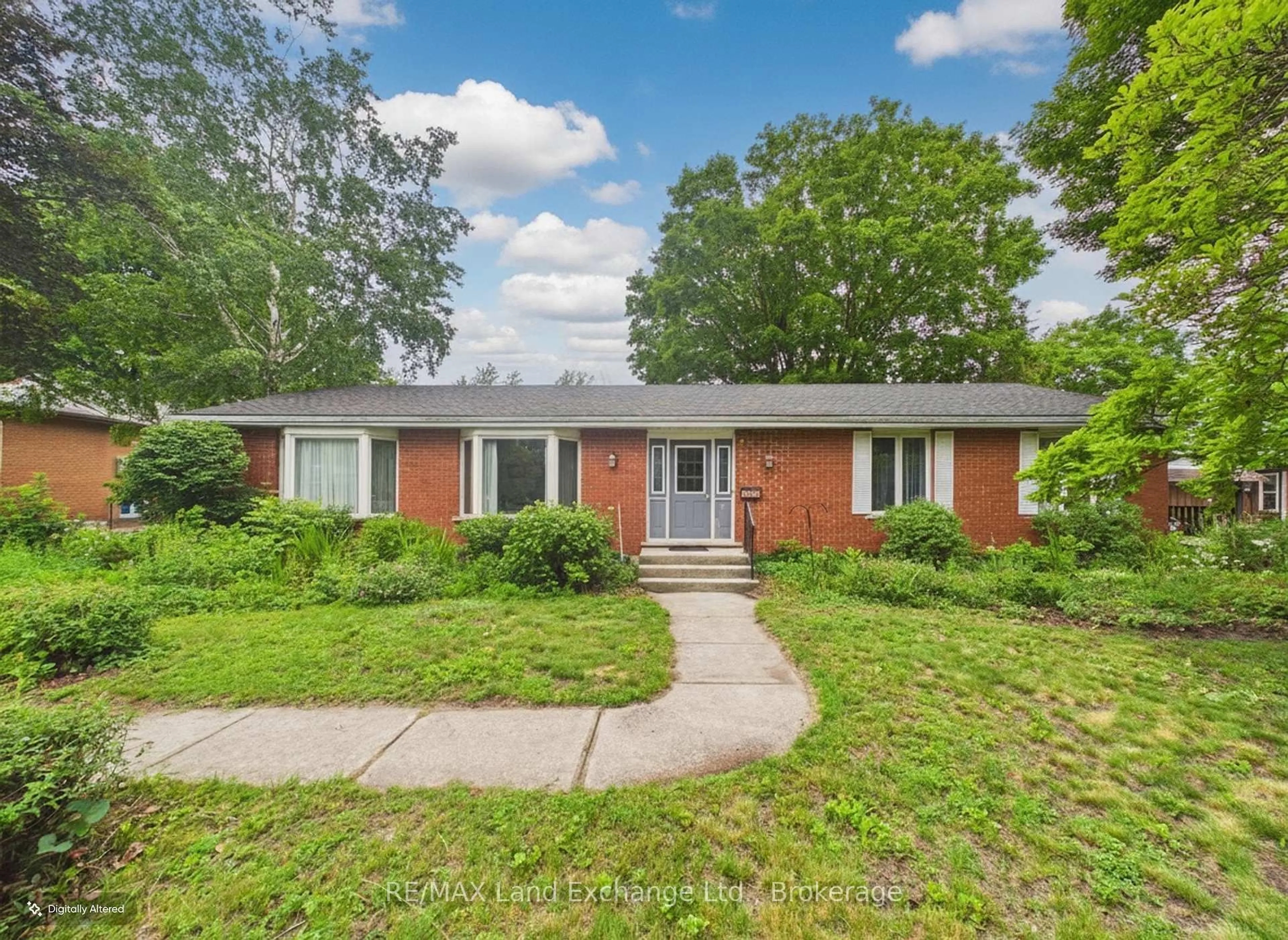 Home with brick exterior material, street for 28 Penetangore Row, Huron-Kinloss Ontario N2Z 2N7