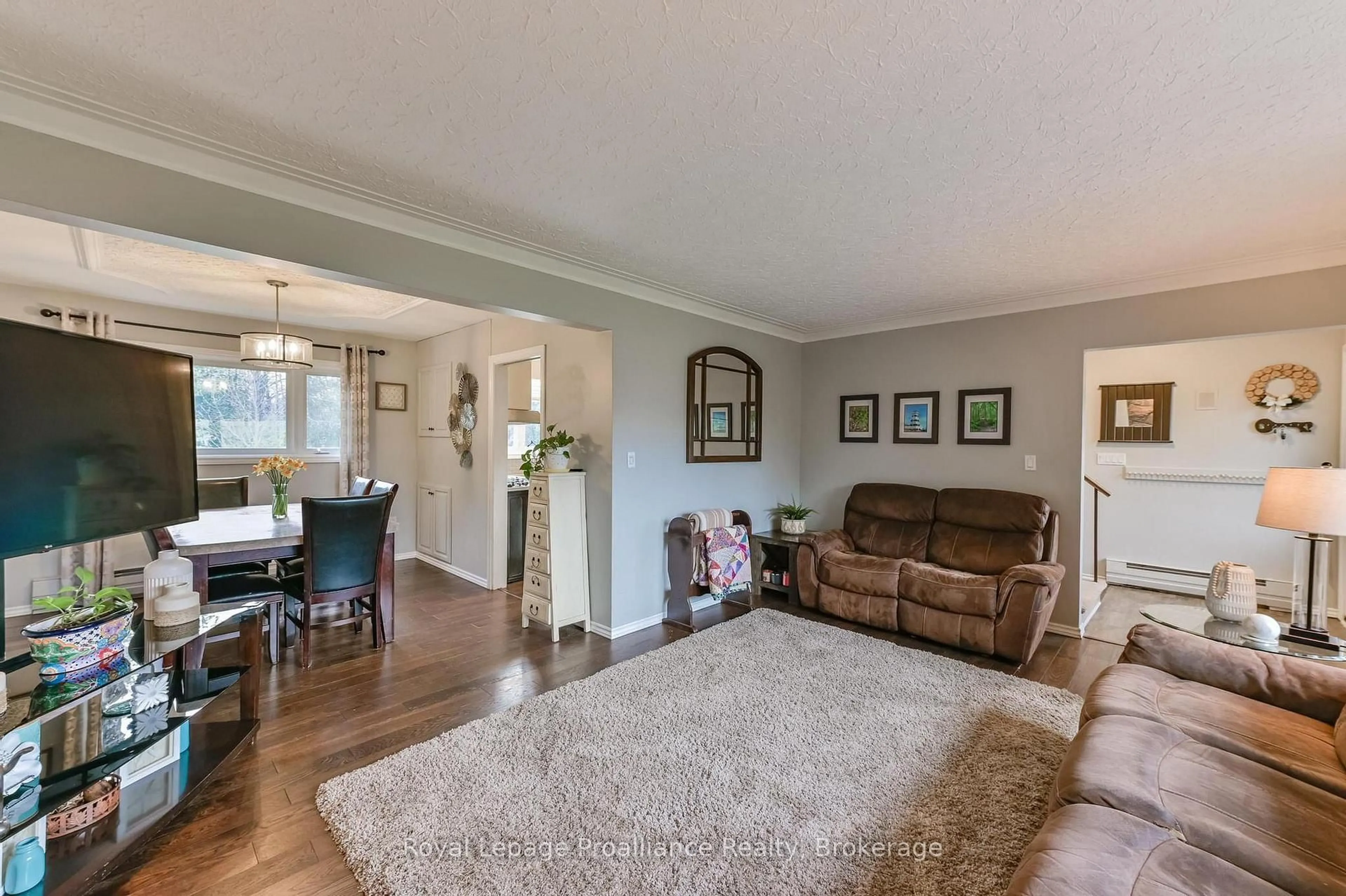 Living room with furniture, wood/laminate floor for 1 Brook Rd, Cobourg Ontario K9A 4G4