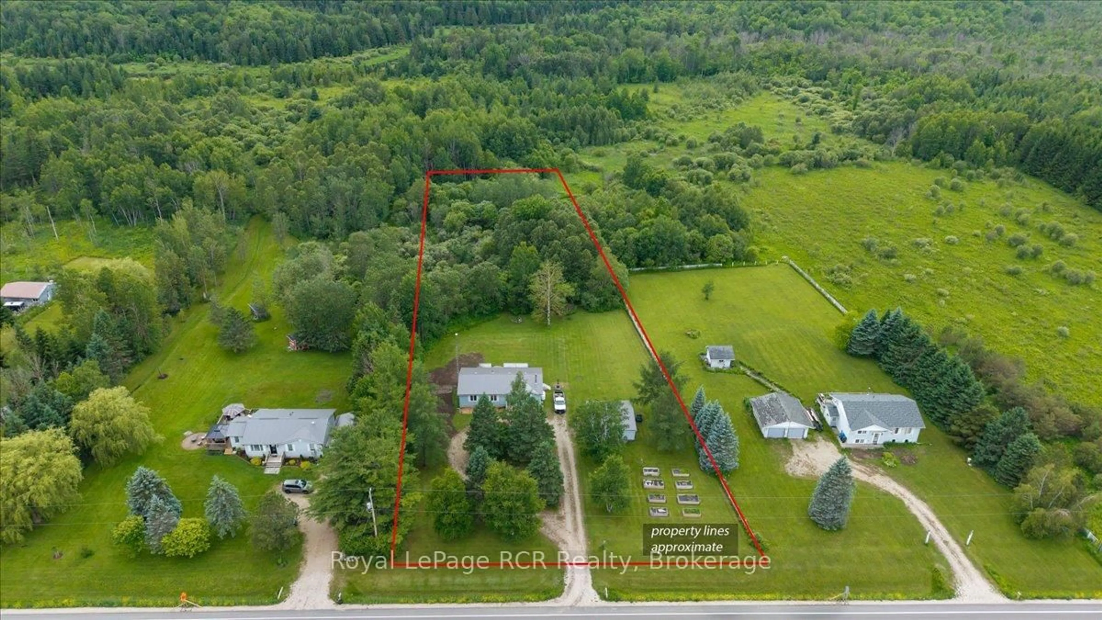 A pic from outside/outdoor area/front of a property/back of a property/a pic from drone, forest/trees view for 111466 Grey Rd 14, Southgate Ontario N0G 1N0