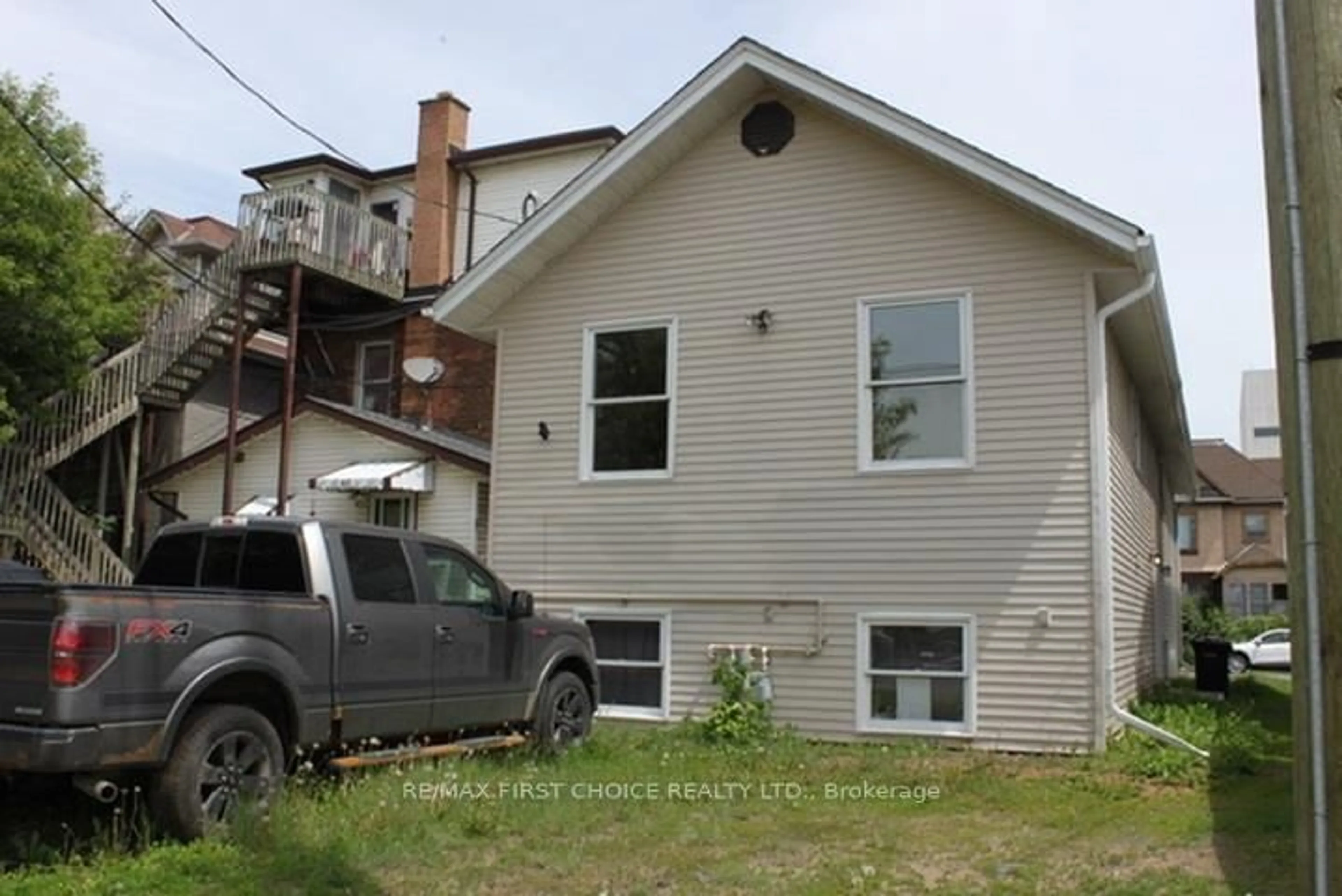 Home with vinyl exterior material, street for 129 McKellar St, Thunder Bay Ontario P7C 3Y9