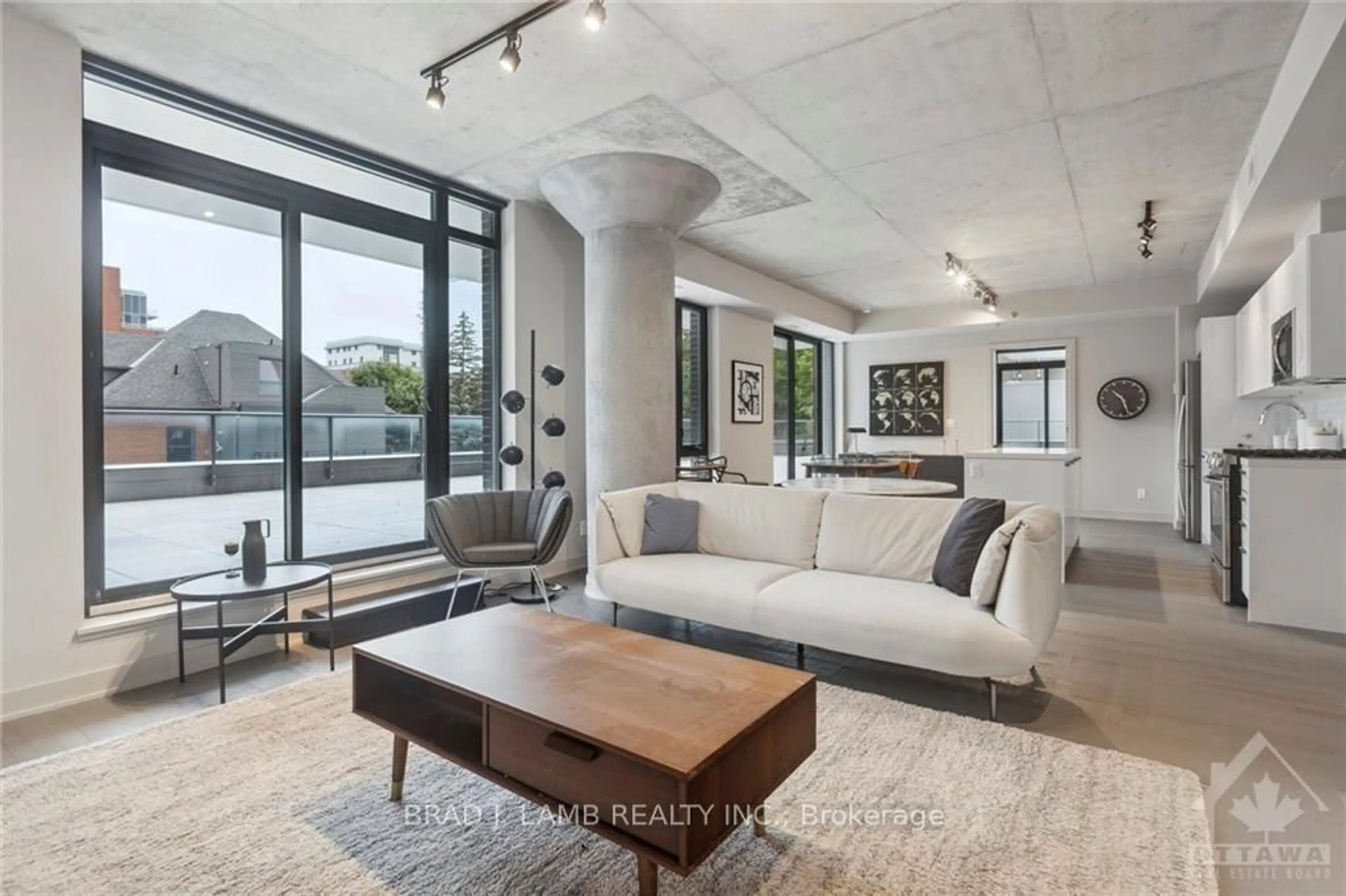 Living room with furniture, cement floor for 203 CATHERINE St #214, Ottawa Ontario K2P 1C3